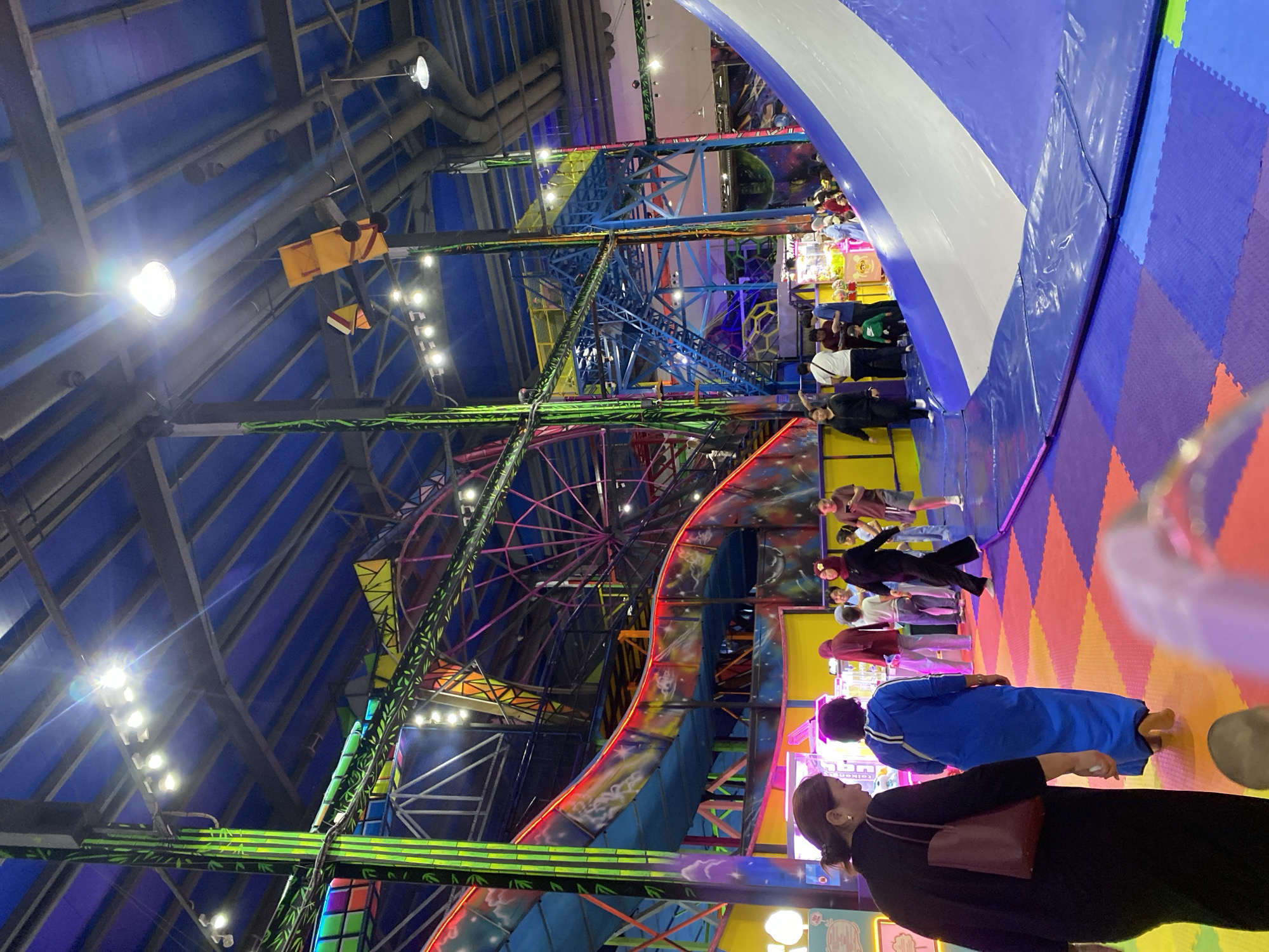 Inside a Bishkek indoor amusement park with rides and attractions