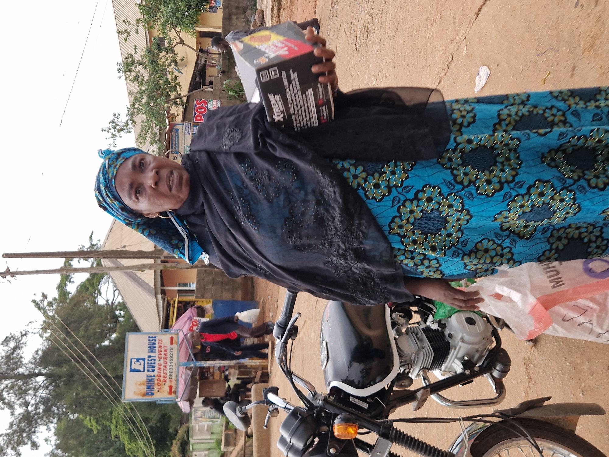 Foot traffic and street commerce on a Jos afternoon