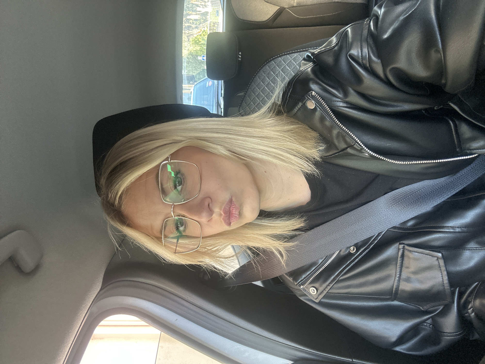 Woman in black leather jacket observed in parked car, Vallauris