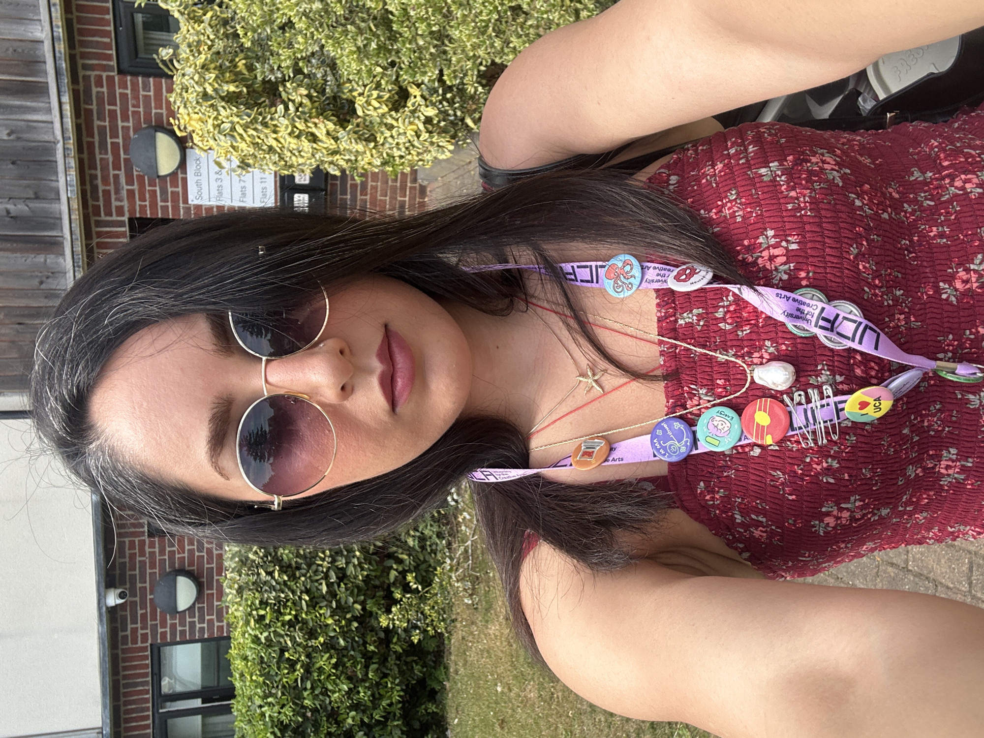 Woman photographed with sunglasses in Epsom and Ewell