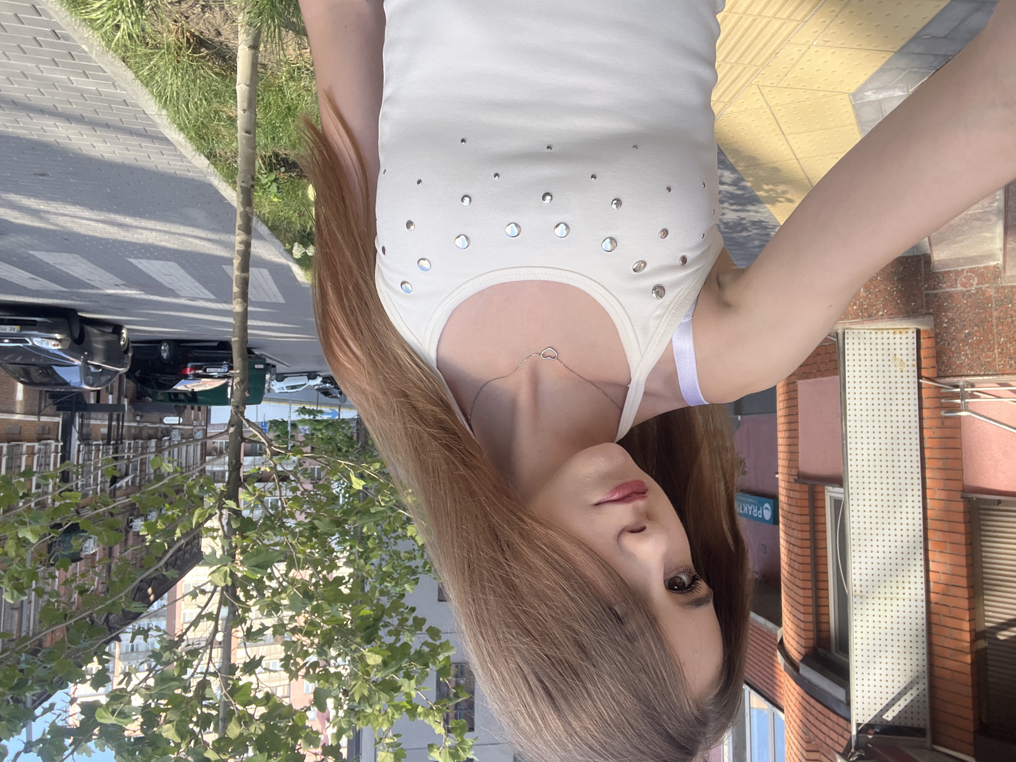 Selfie session on a sunny Dnipro pedestrian street