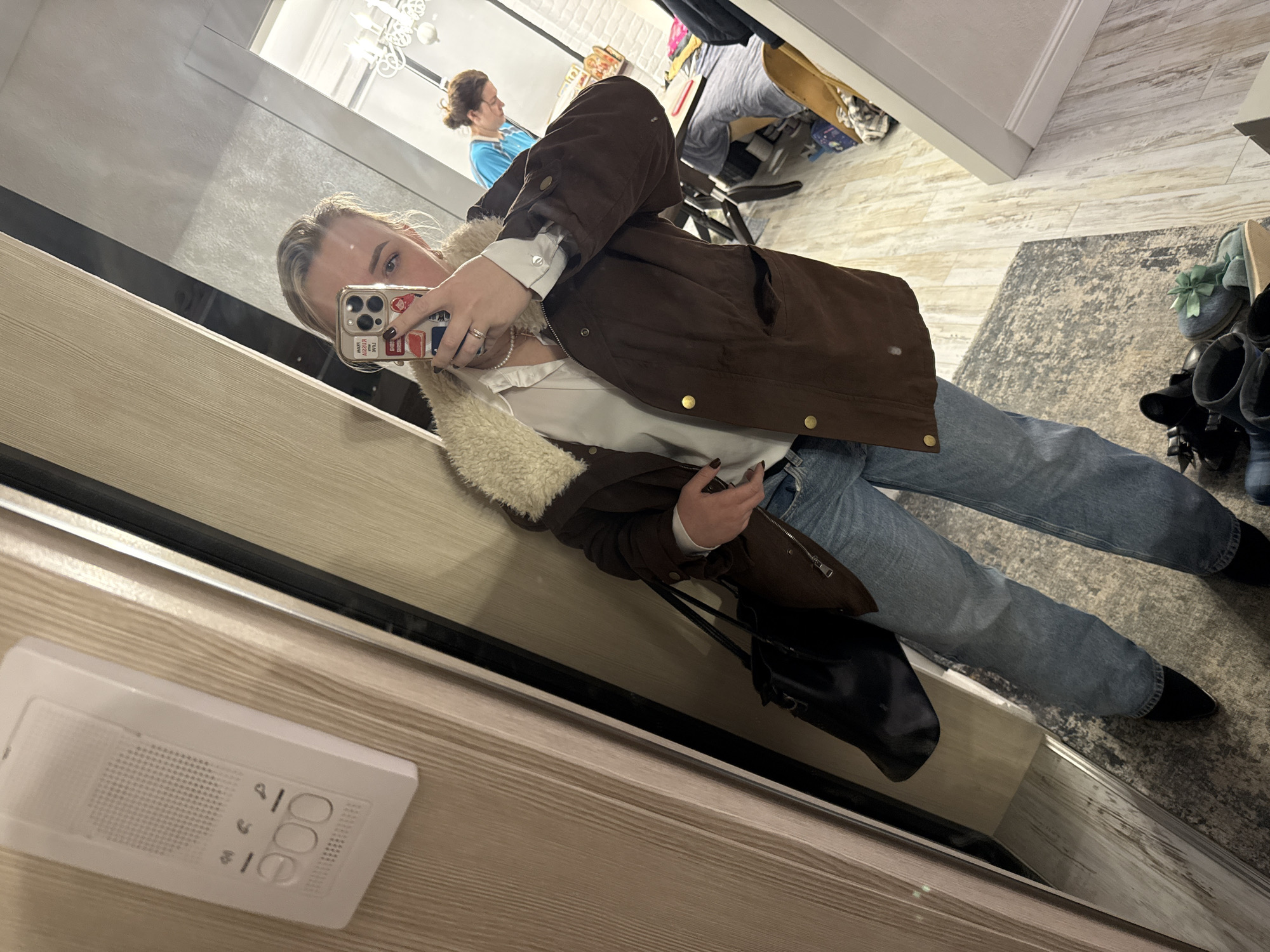 Woman takes mirror selfie in Chaikovsky, Russia