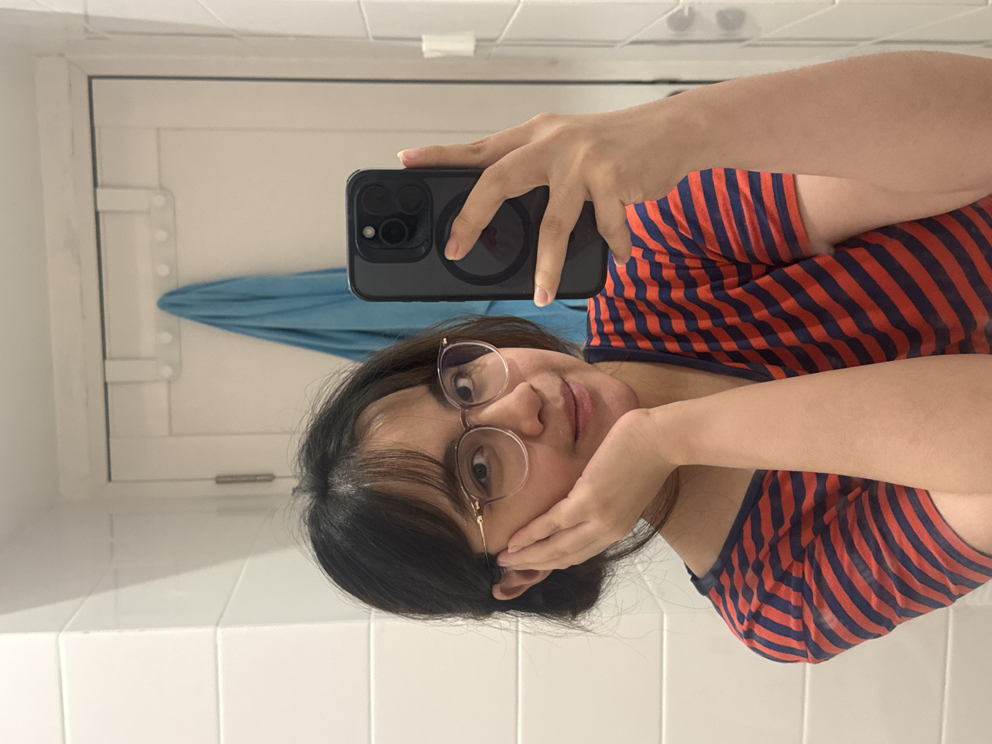 Woman takes bathroom selfie in Bekasi, Indonesia