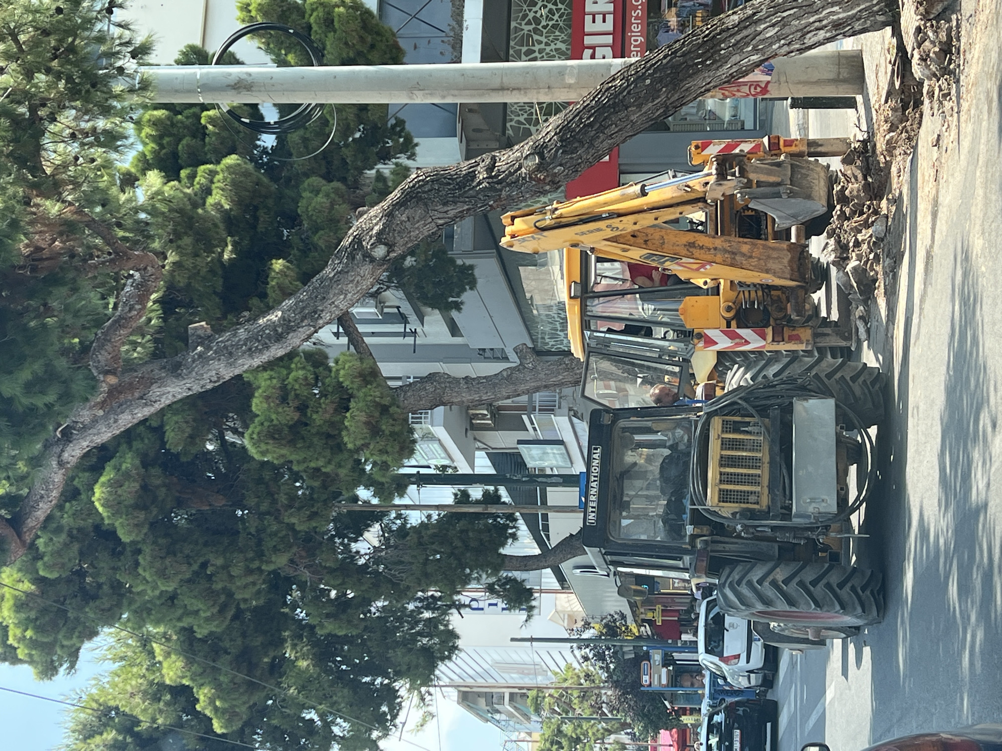 Street excavation and bougainvillea gate in Kallithea, Greece