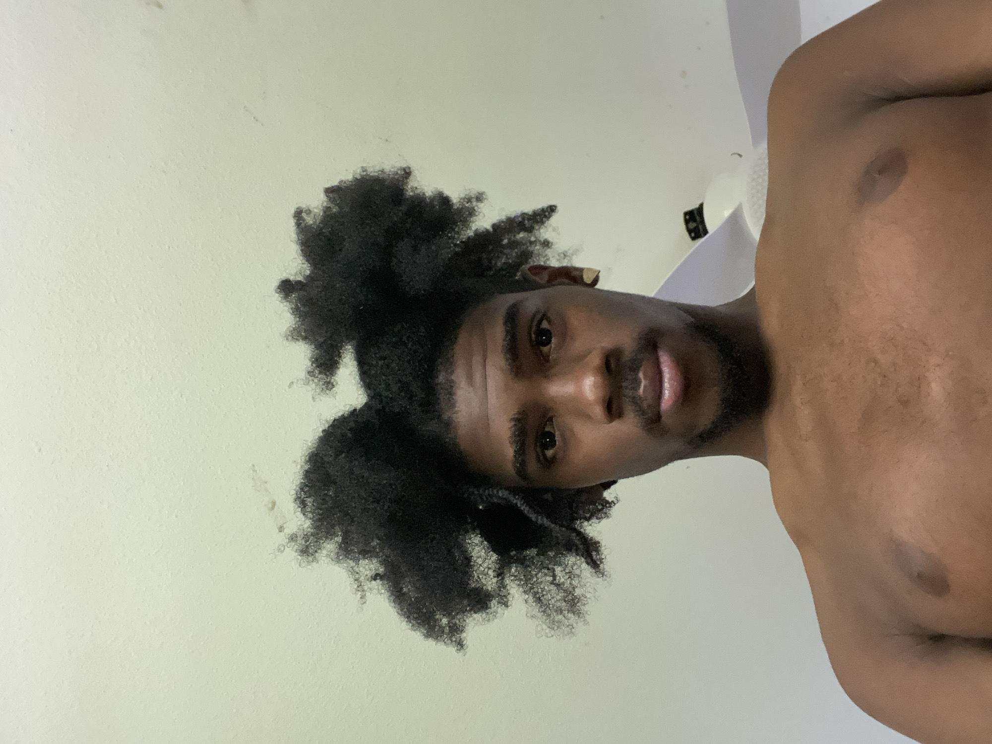 Man photographed in residential settings in Capesterre-Belle-Eau