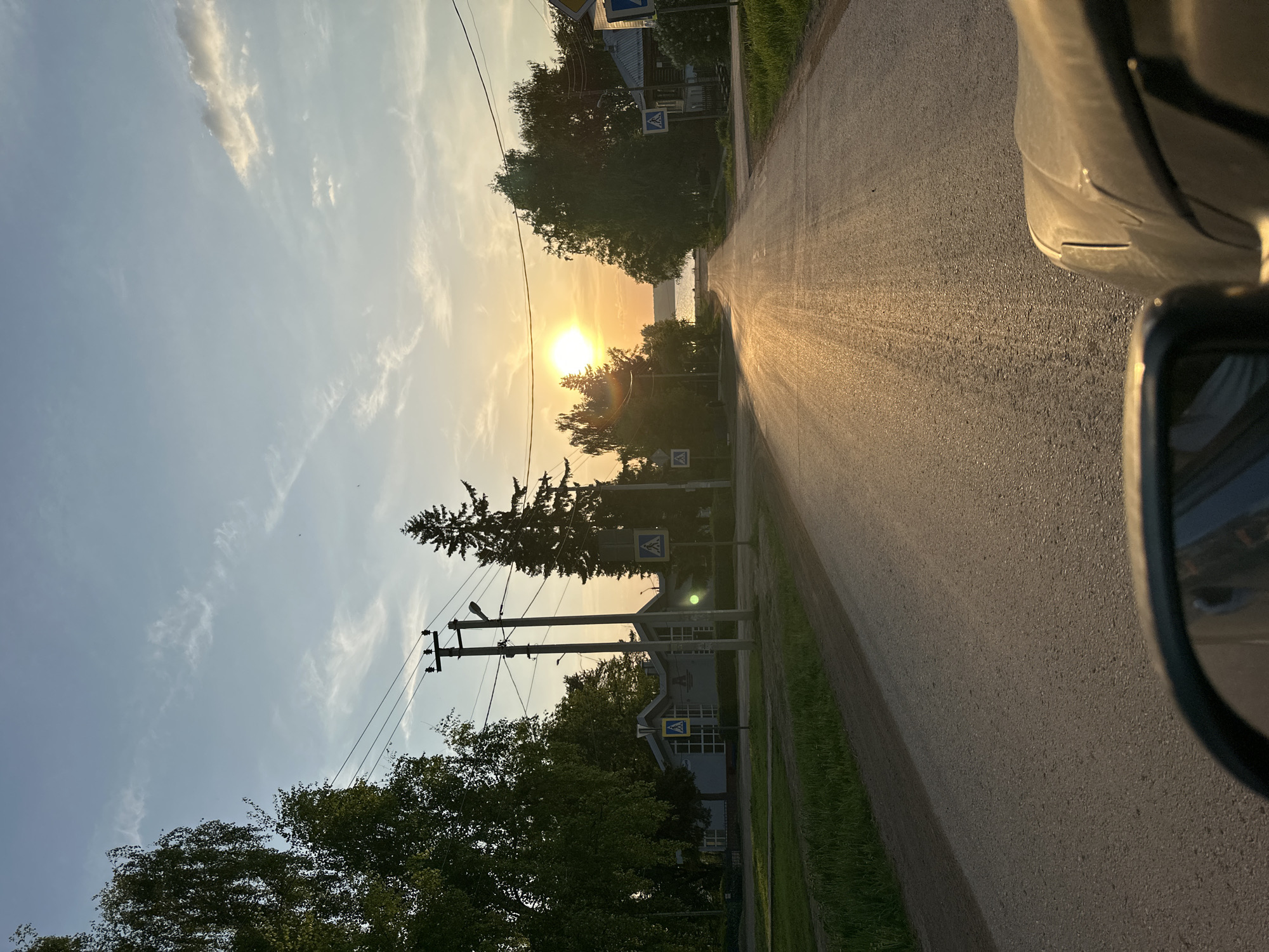 Sunset drive through Ilyinsky captures school zone, worn roads