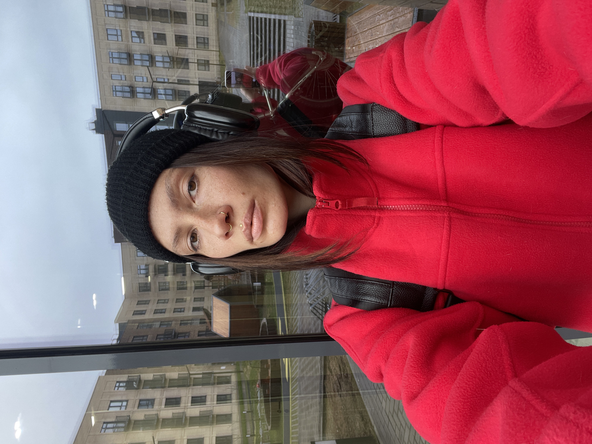 Woman takes selfie indoors in Pervomaysky, Russia