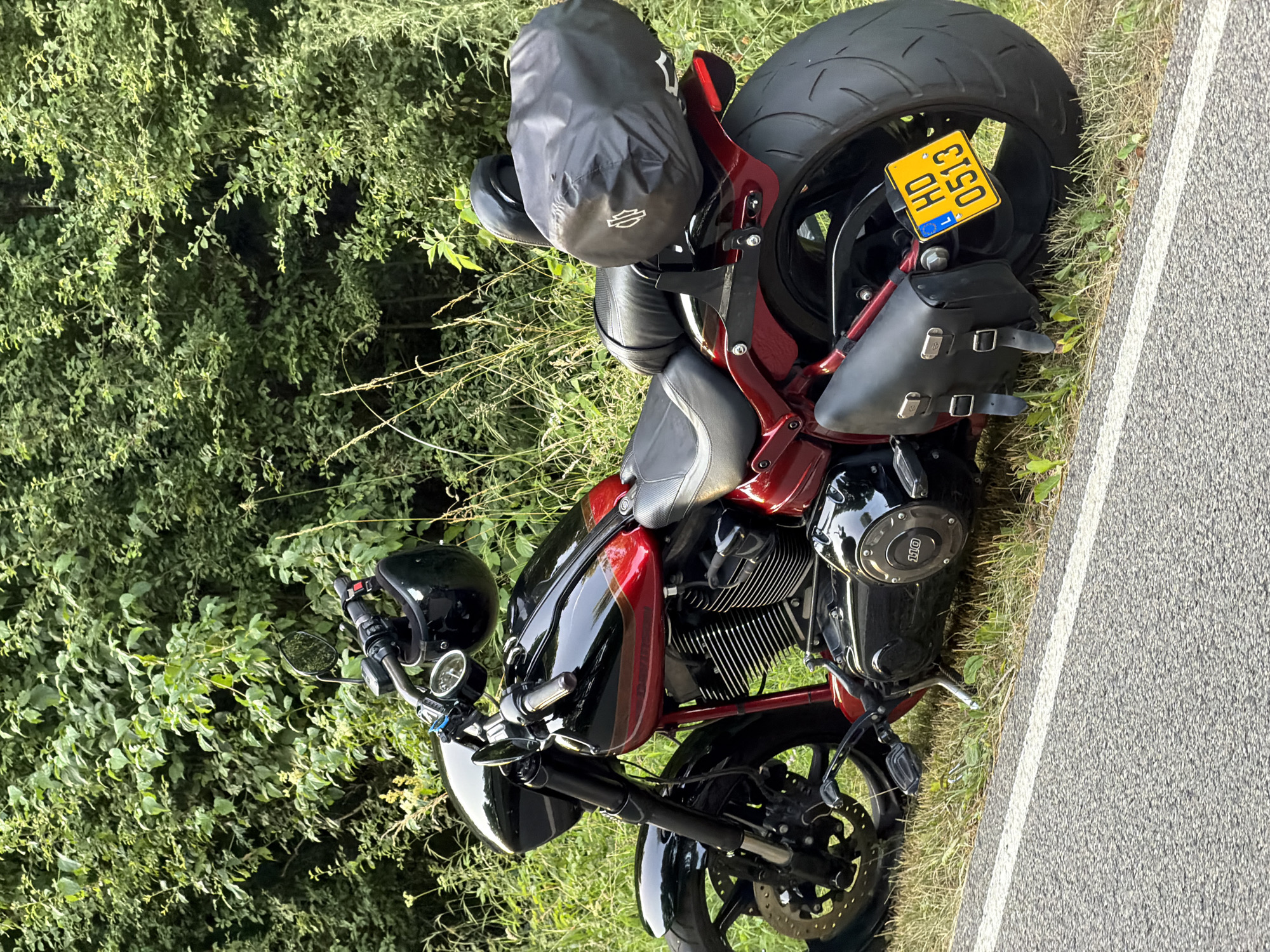 Several motorcycles parked roadside in Mensdorf, Luxembourg