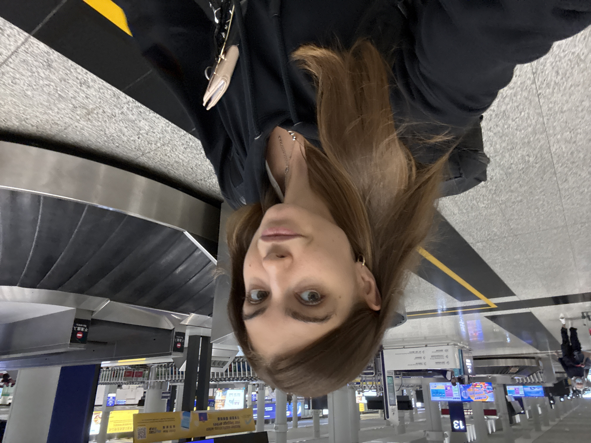 Woman takes selfie at Hong Kong International Airport