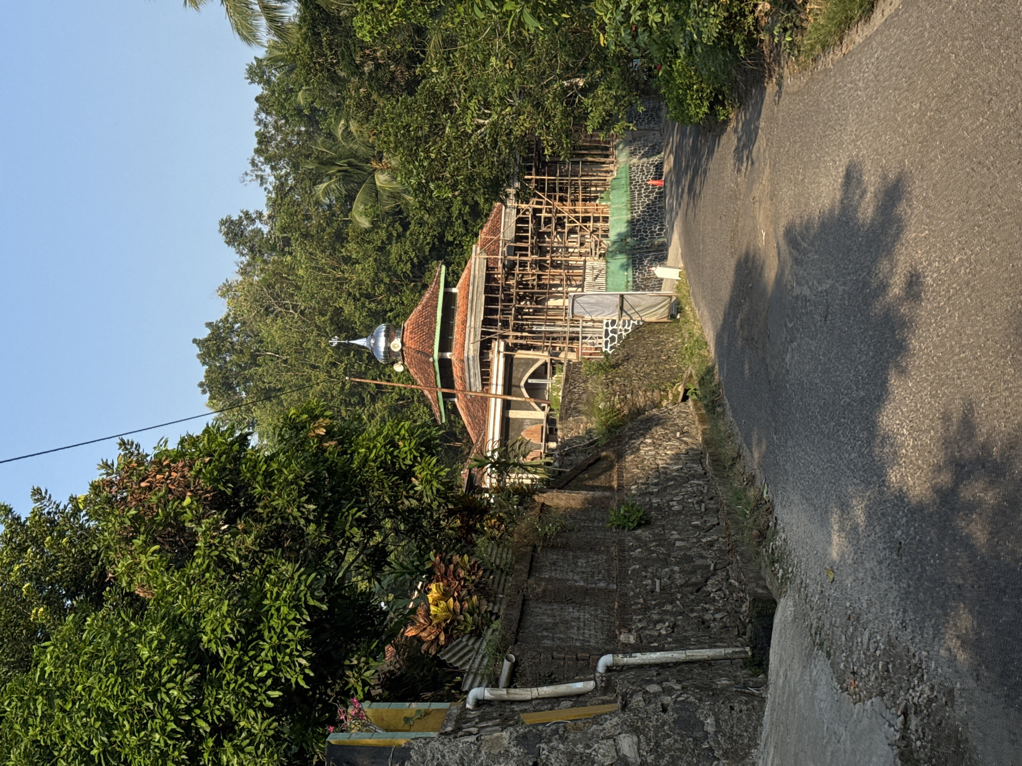 Rural life and winding roads through Alian's tropical landscape