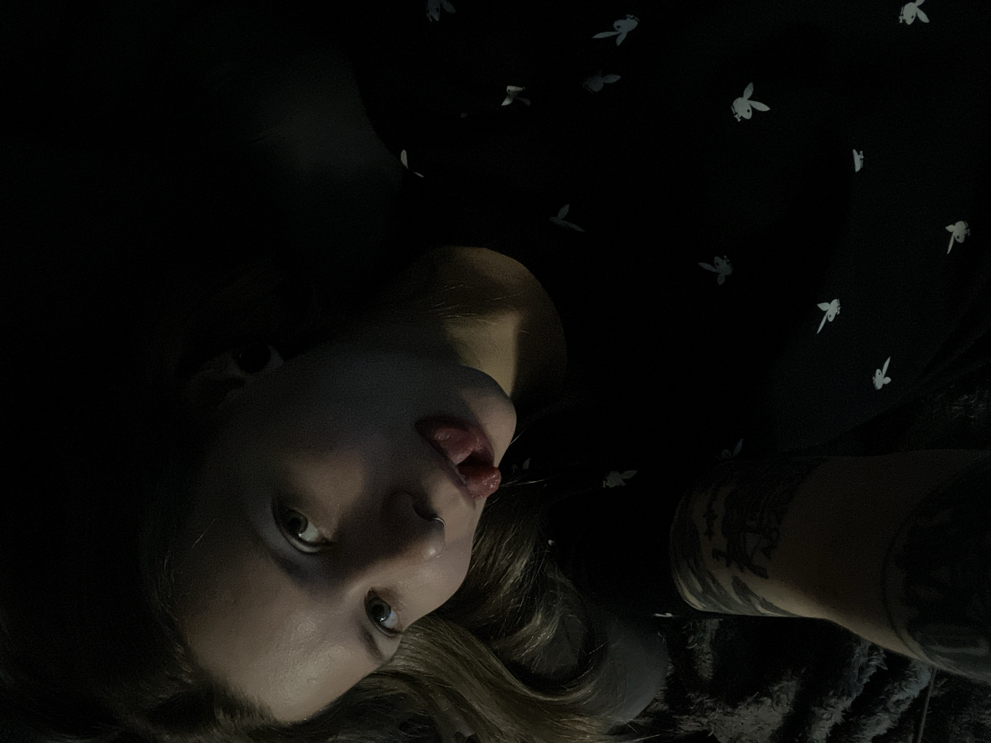 Woman poses for photo in low-lit environment in Khimki