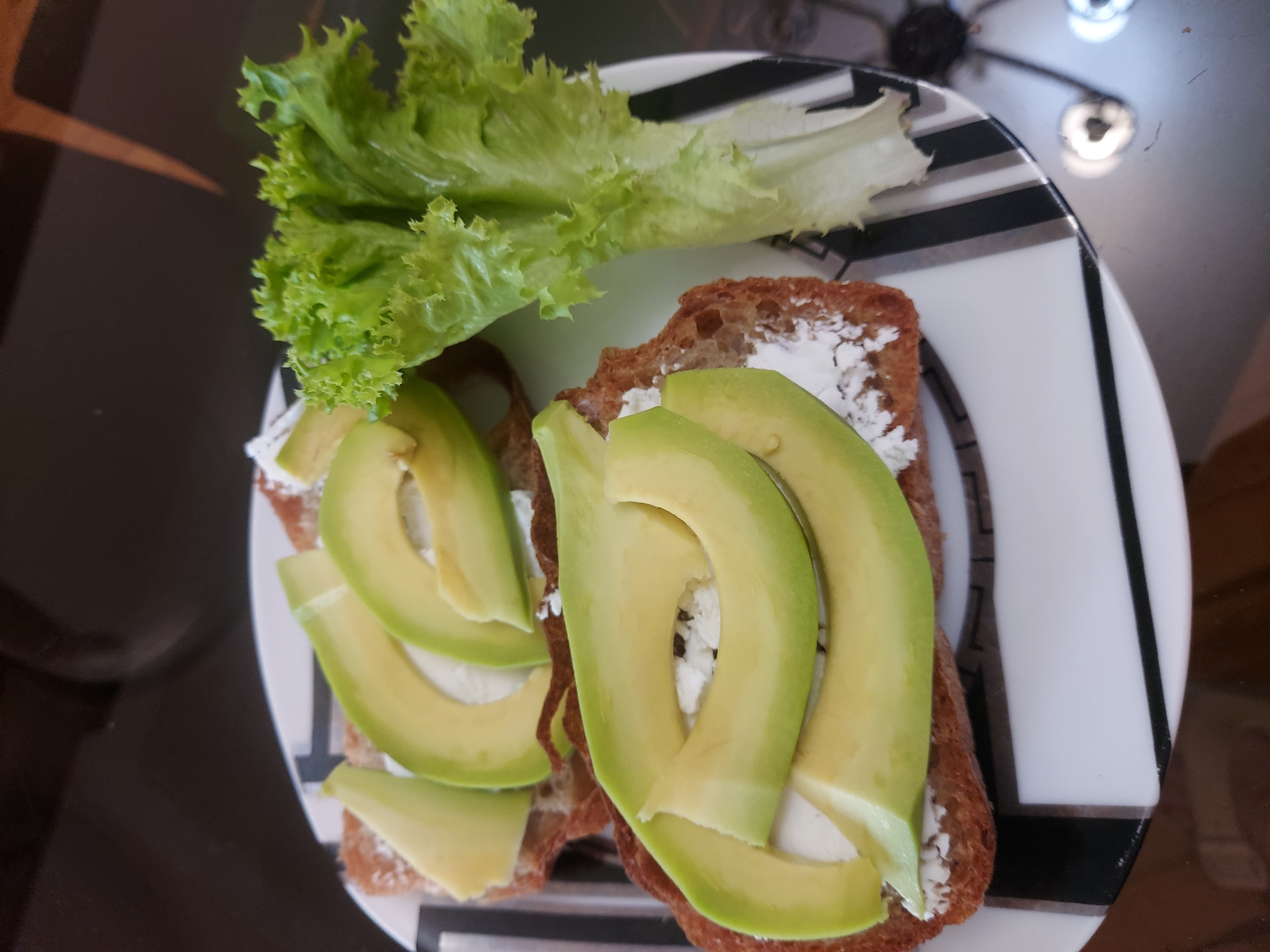 Avocado toast on a striped plate in Yerevan