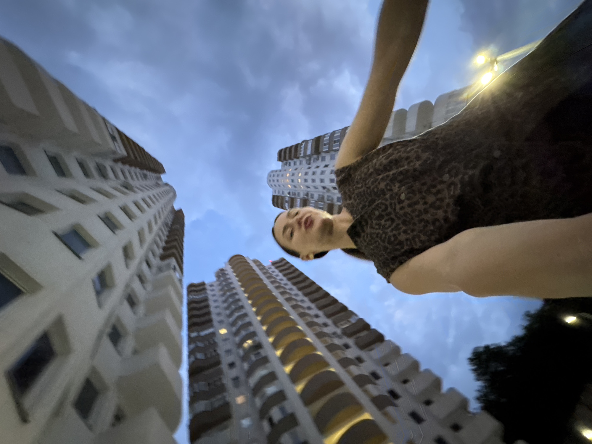 Woman Documents Flowers and Night Views from Sochi Apartment