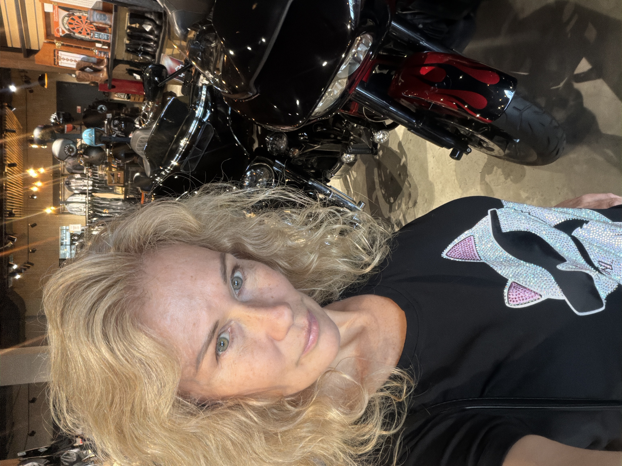 Woman visits Harley-Davidson dealership and motorcycle cafe in Saint Petersburg