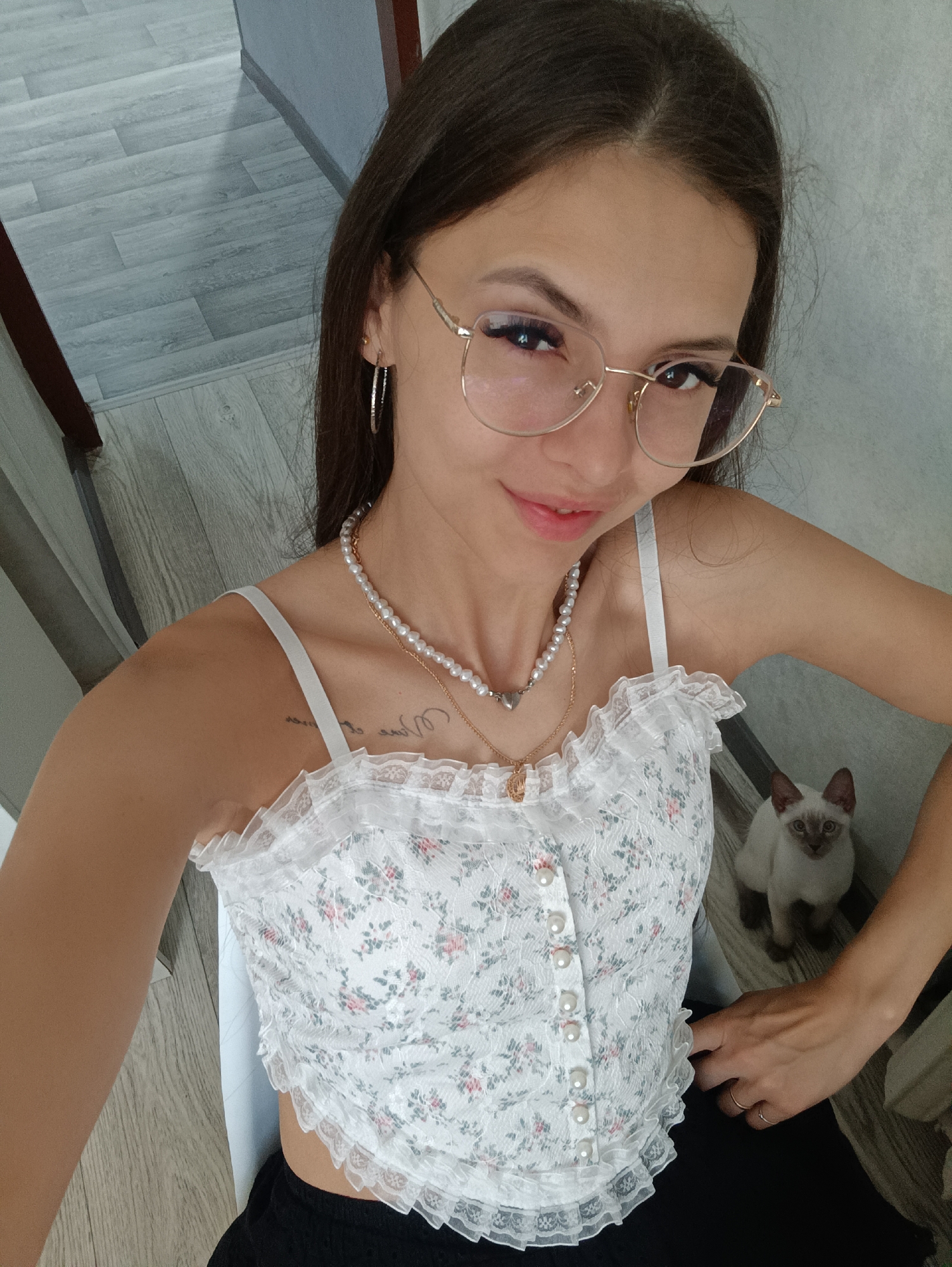 Casual selfies at home, including a kitten cameo
