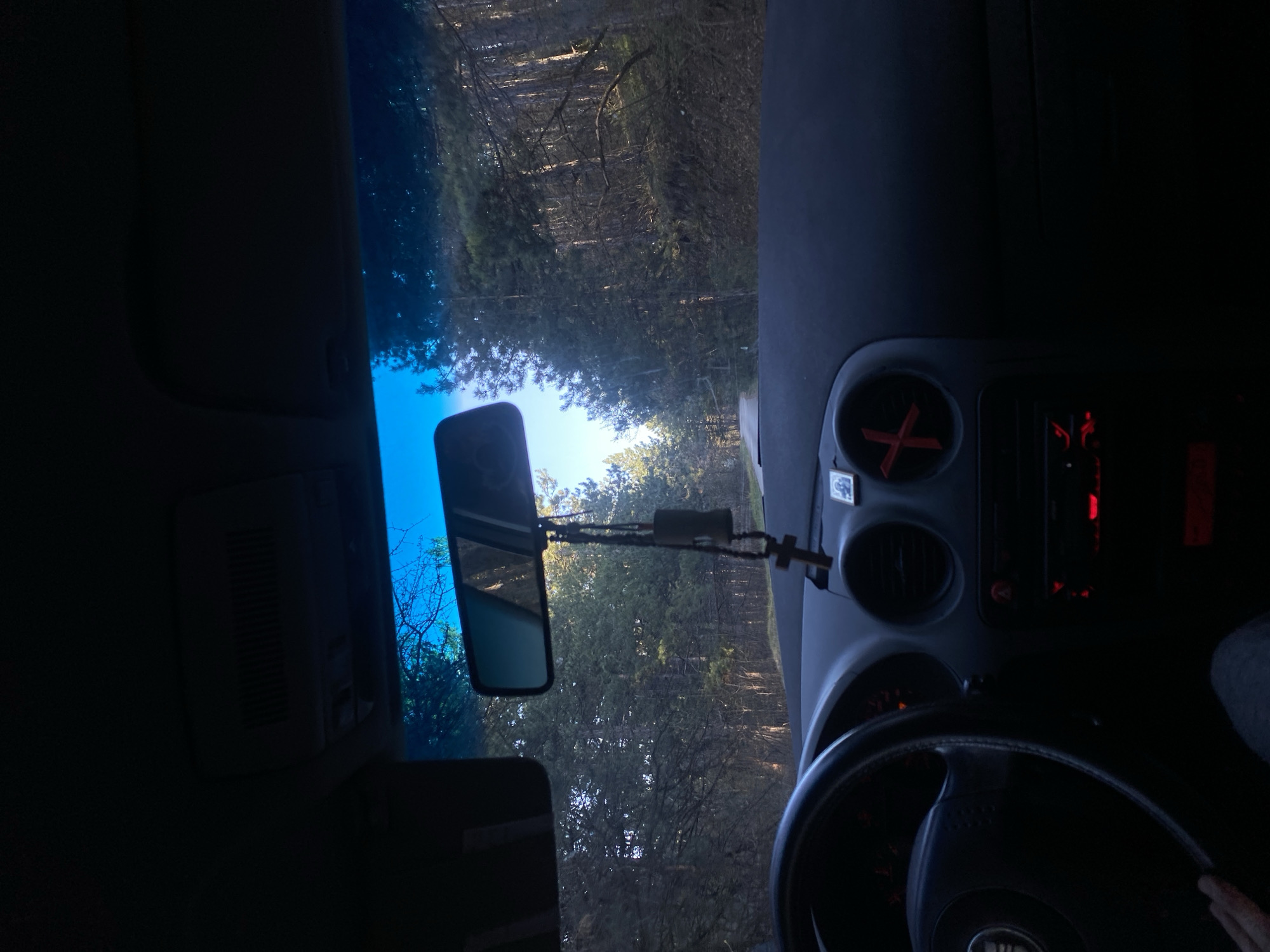 Driver travels wooded road near Blagoevgrad, Bulgaria
