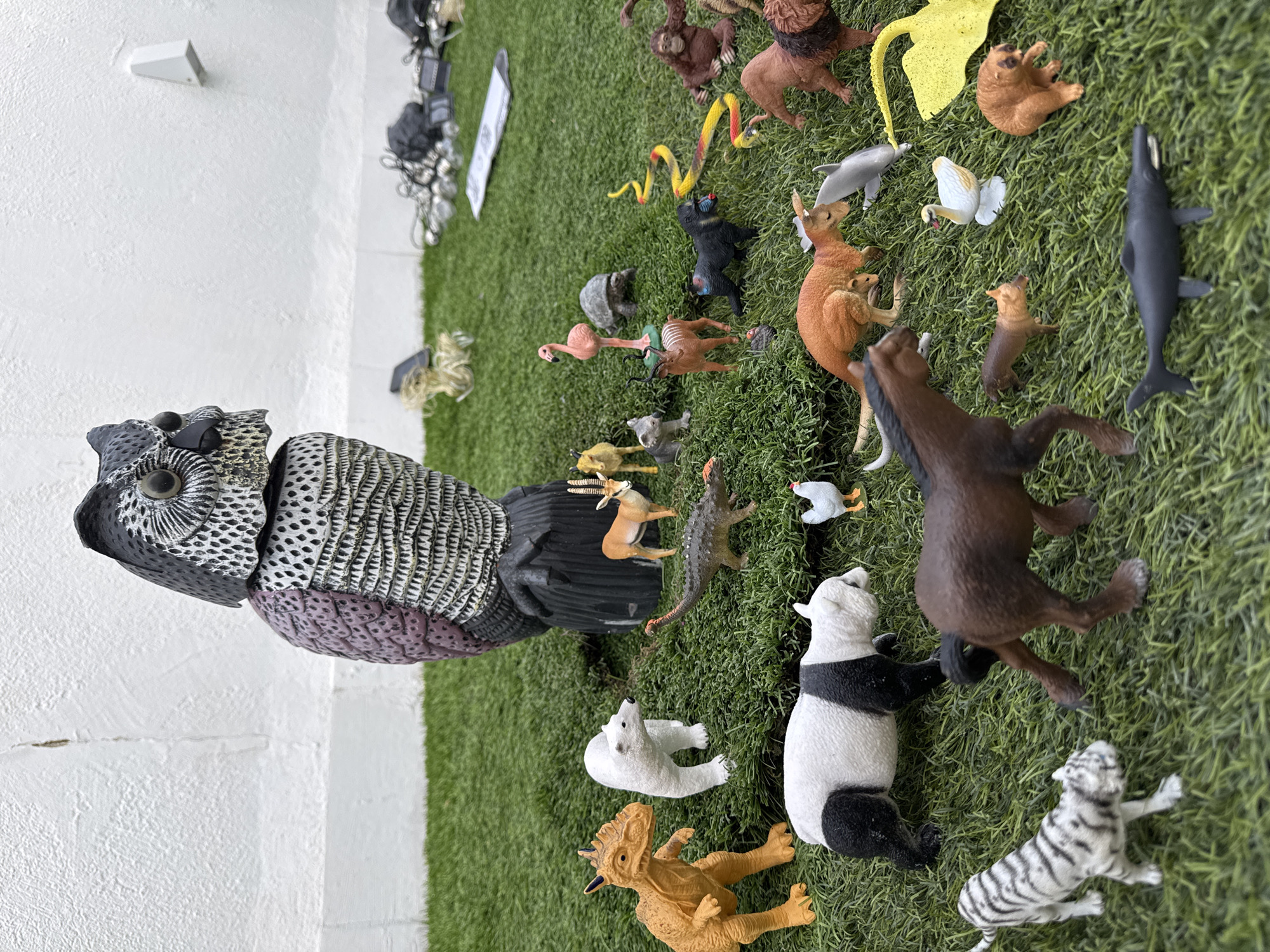 Toy animal collection and garden details, backyard in Vallada