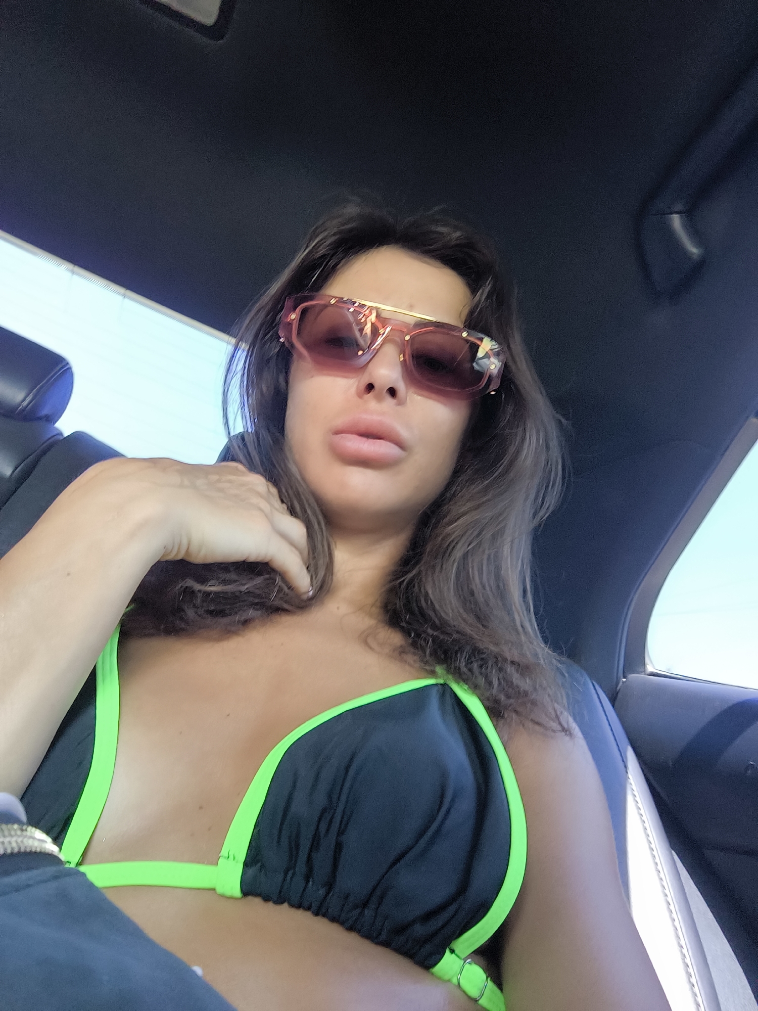 Backseat moment in Pallini, pink sunglasses front and center