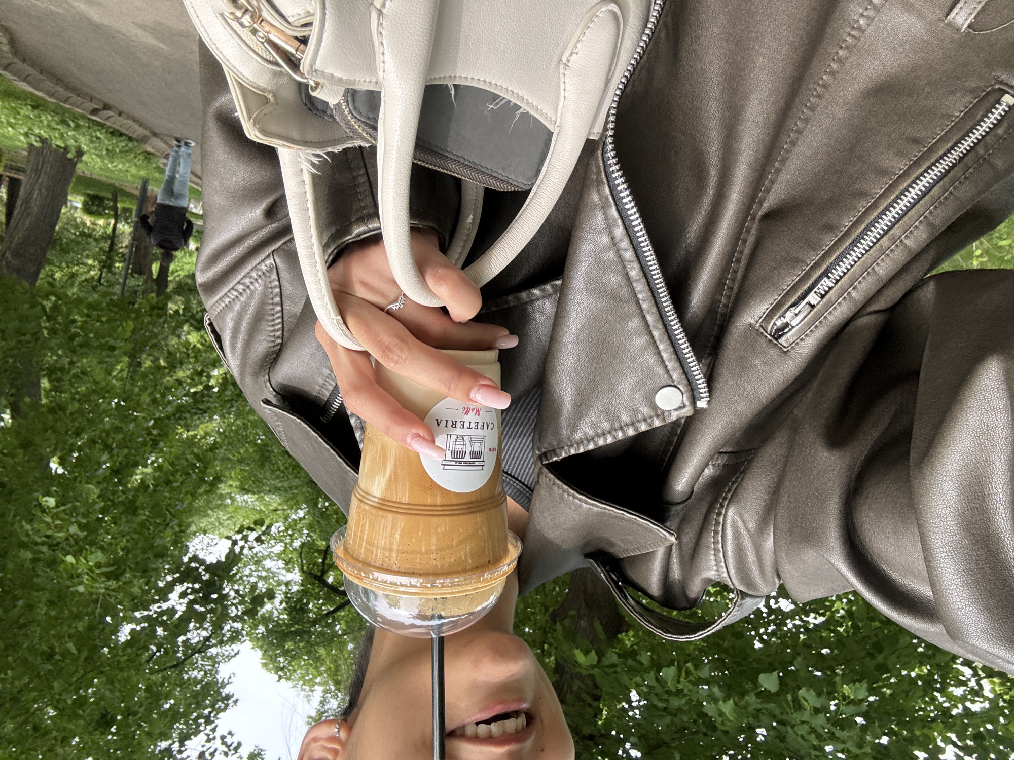 Woman enjoys morning iced coffee in Dupnitsa, Bulgaria