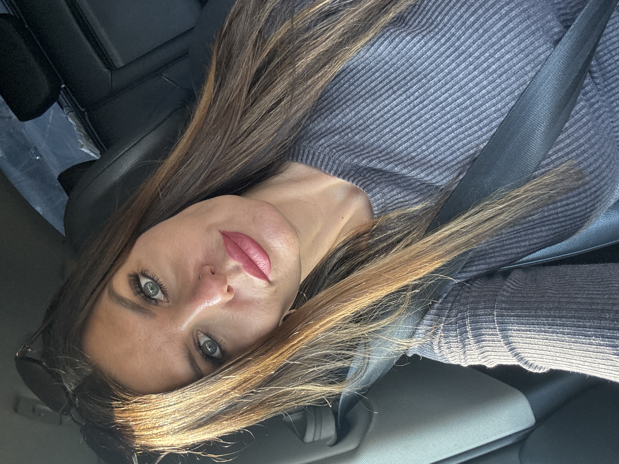 Woman takes car selfies in Chaikovsky, Russia