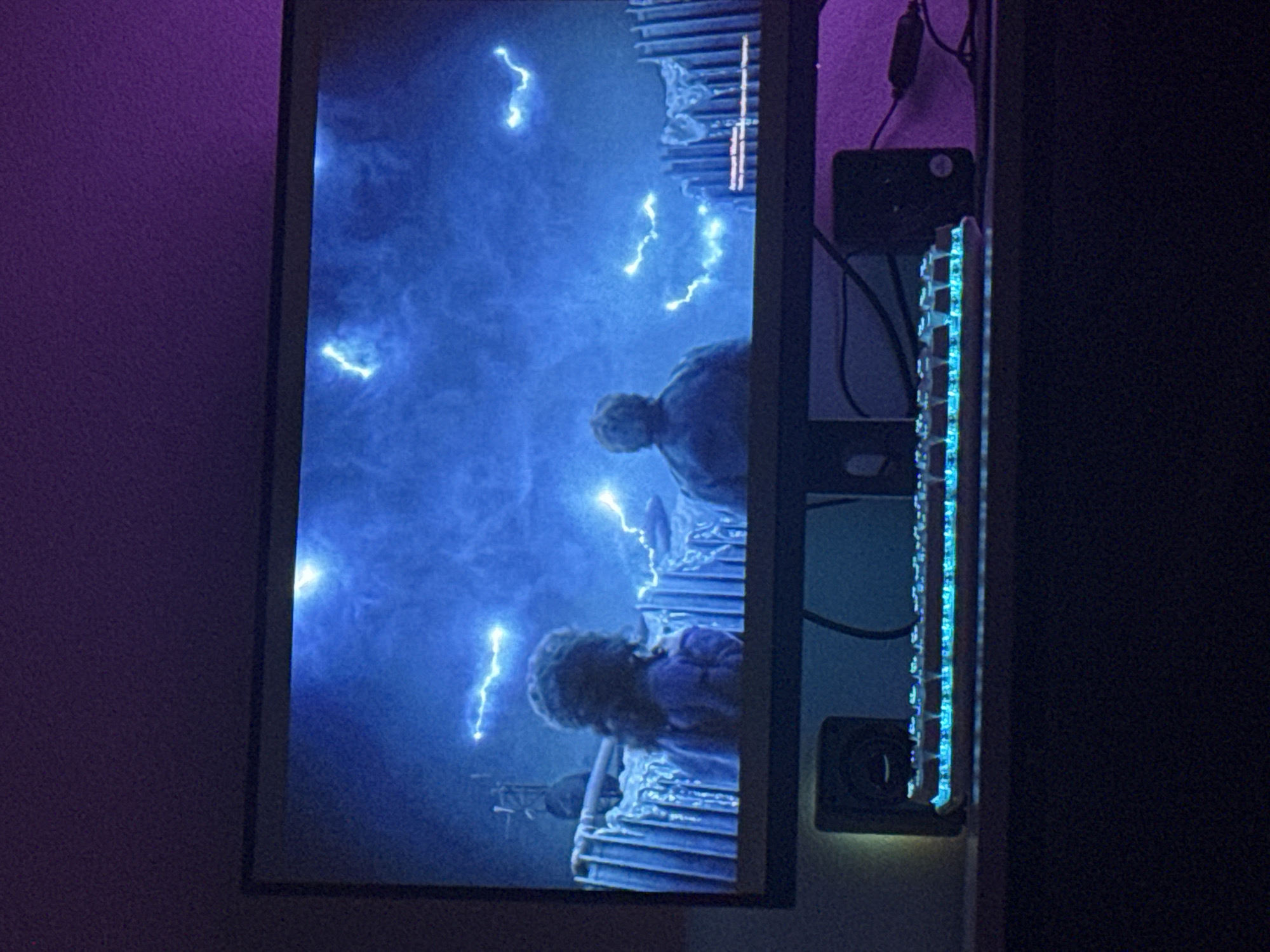 Monitor displays digital scene with lightning effects