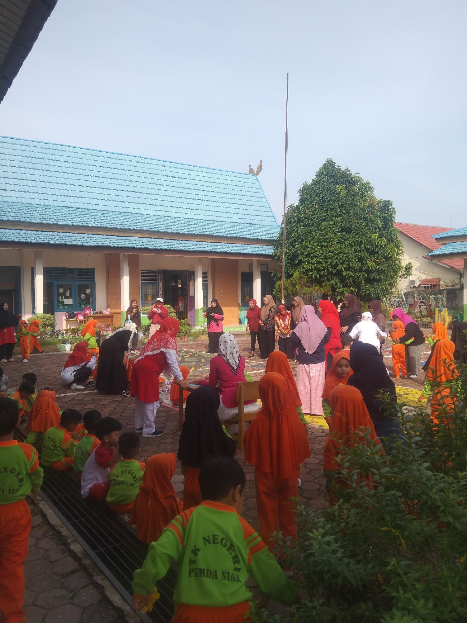 Kindergarten kids at play in Siak Sri Indrapura schoolyard