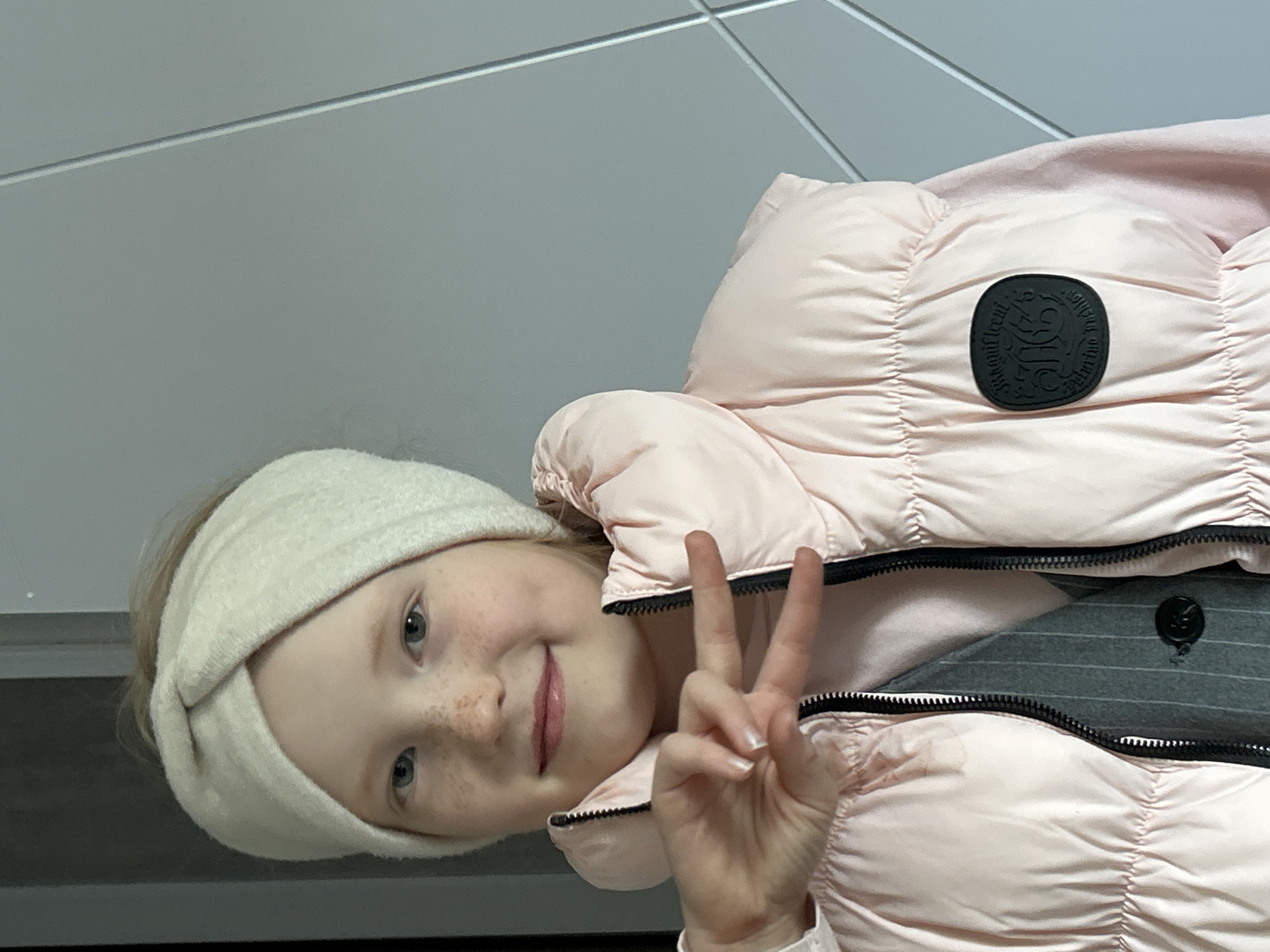 Girl plays with Disney phone case in Chaikovsky