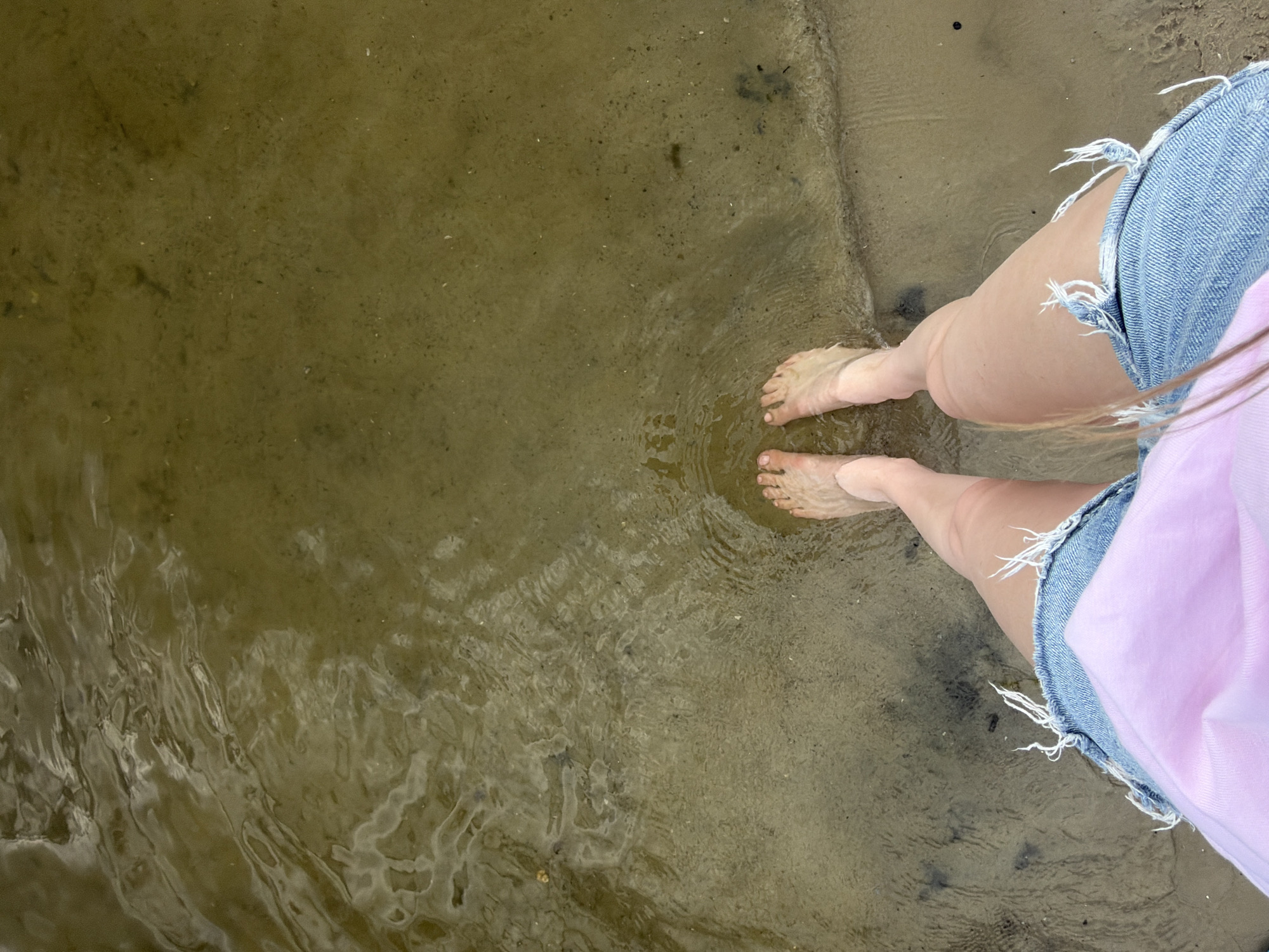 Wading and playing on the Dnipro River on a summer afternoon