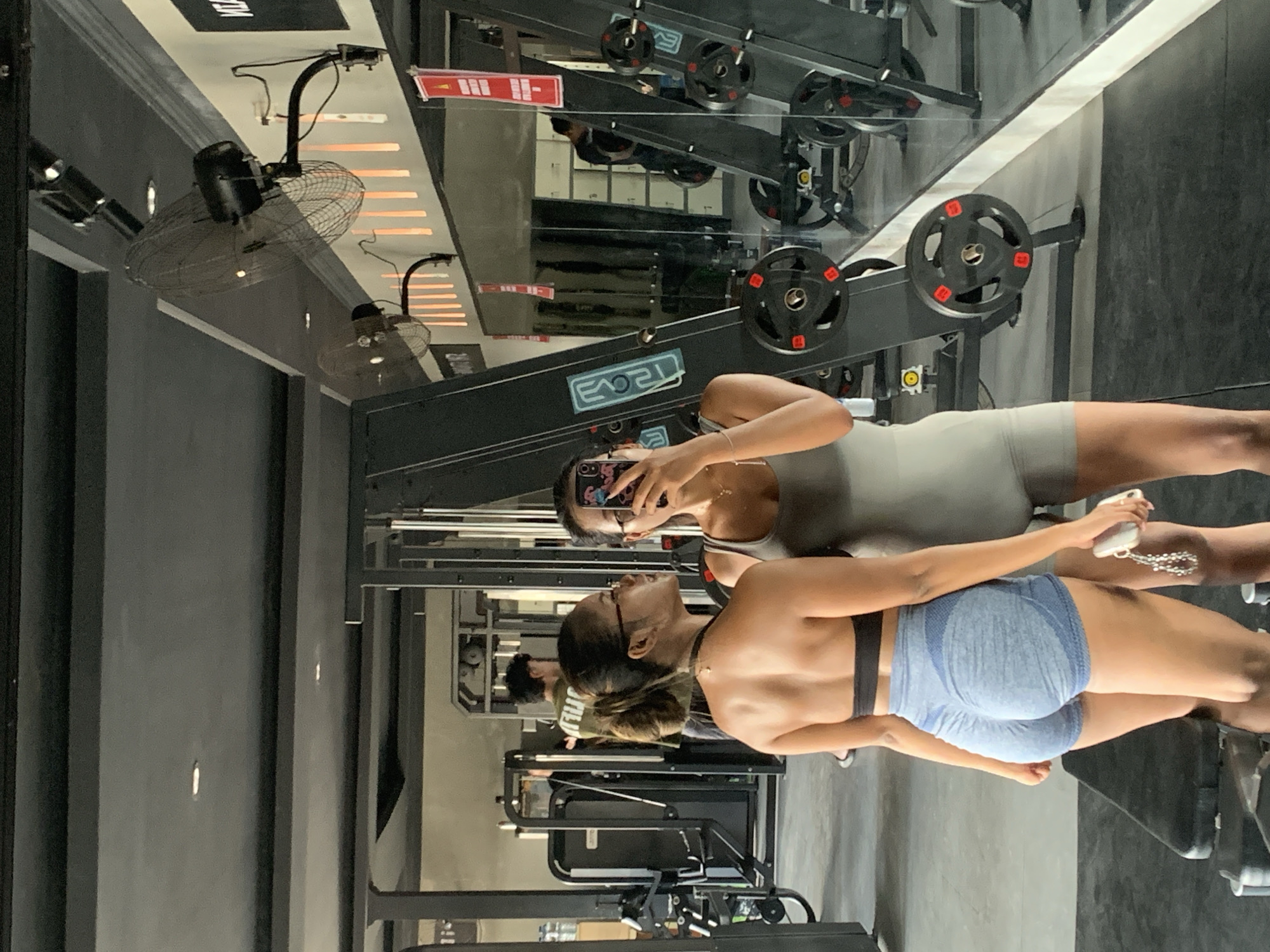 Women take gym selfies during workout in Sukawati