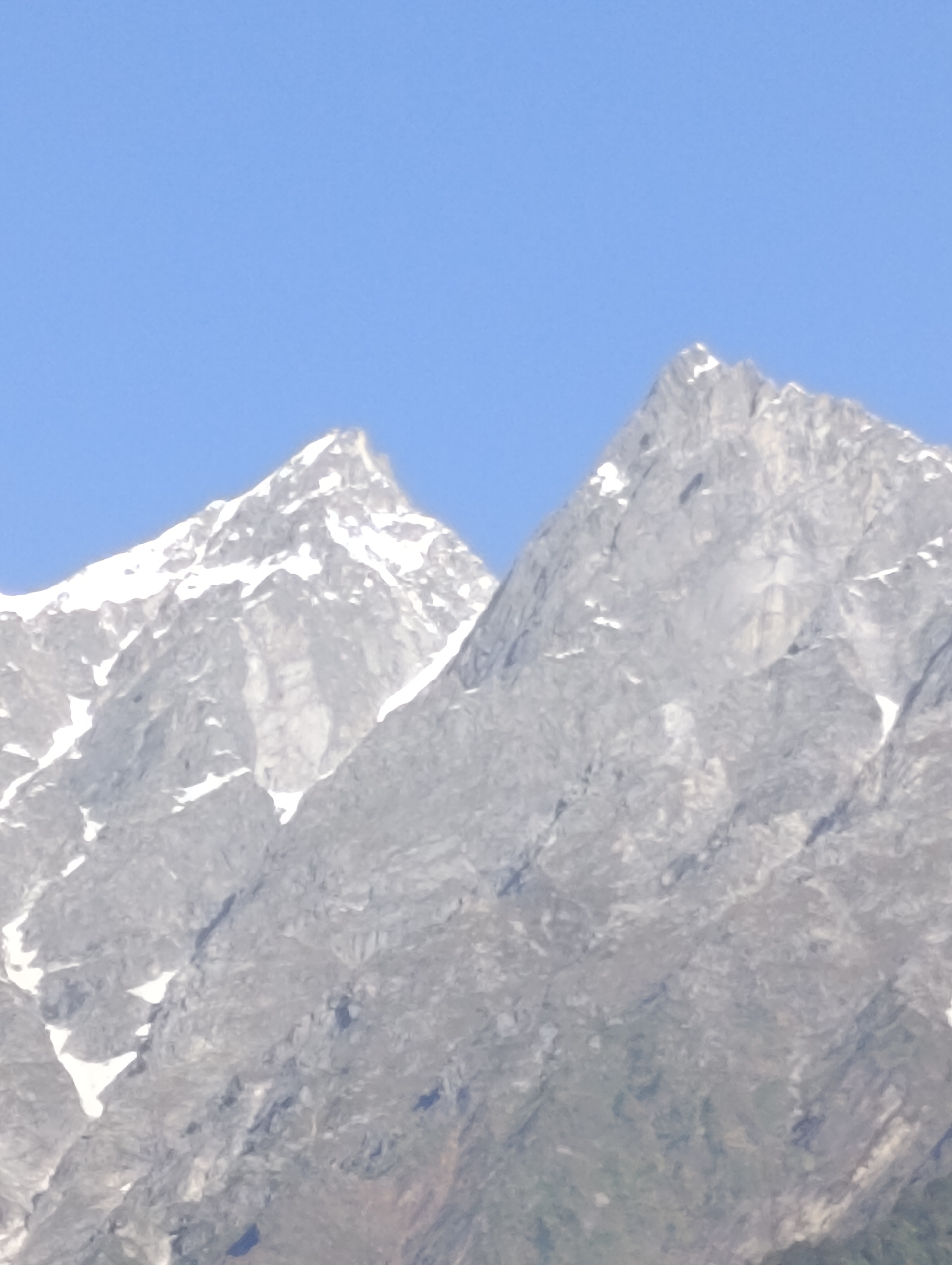 Snow peaks and pine hills frame a small Kulang settlement