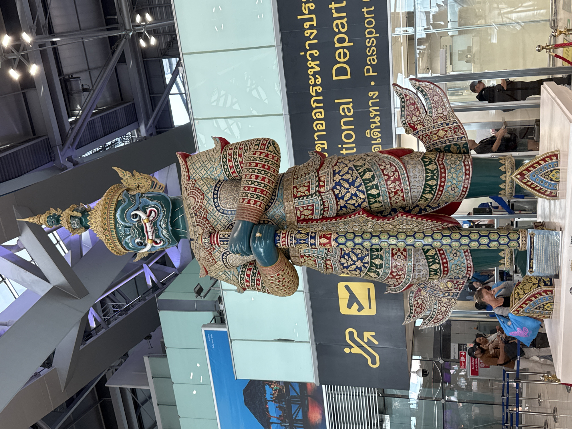 Ornate blue-faced statue displayed at Bangkok's Suvarnabhumi Airport