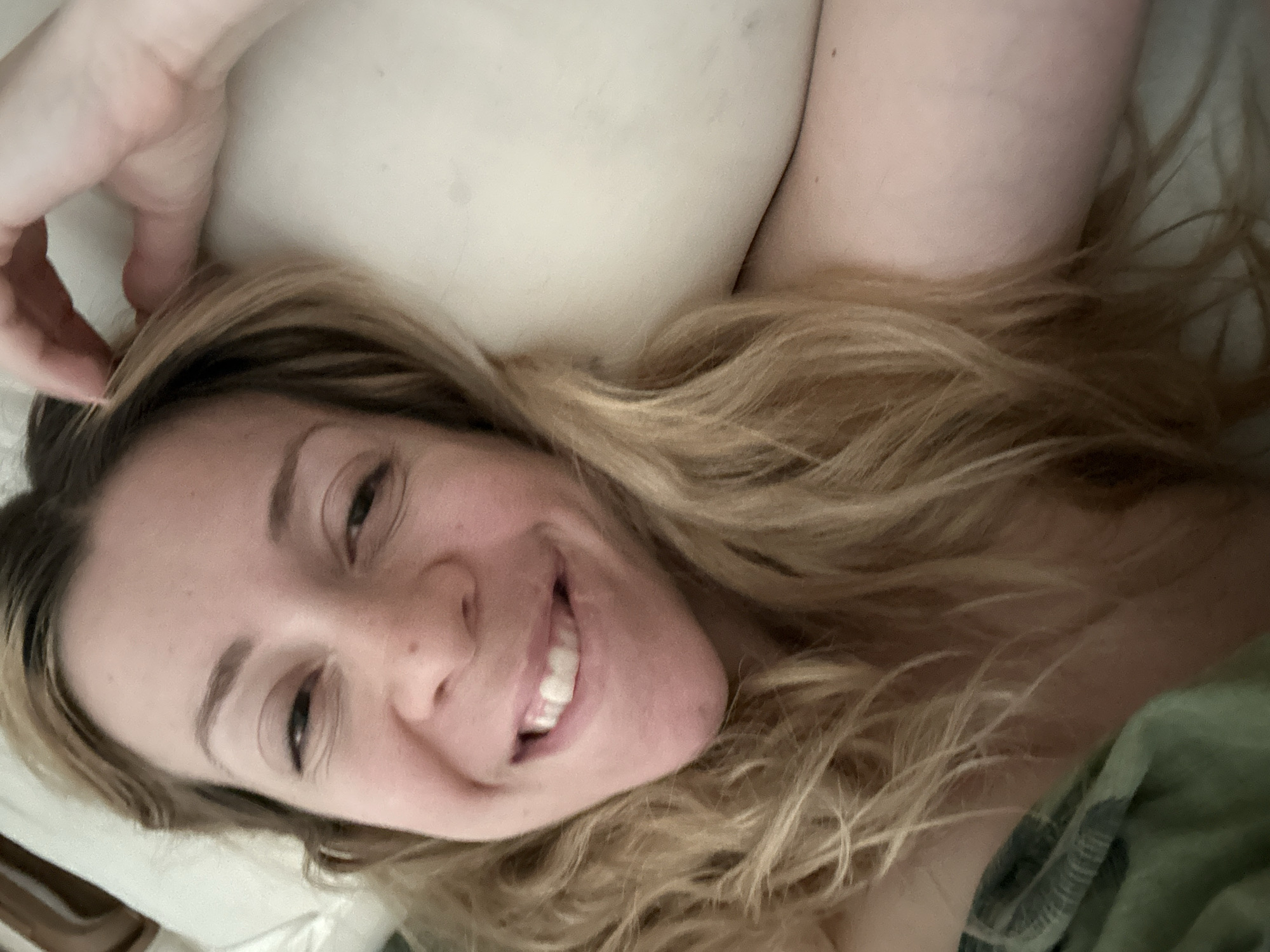 Woman resting on pillow observed in Amsterdam morning