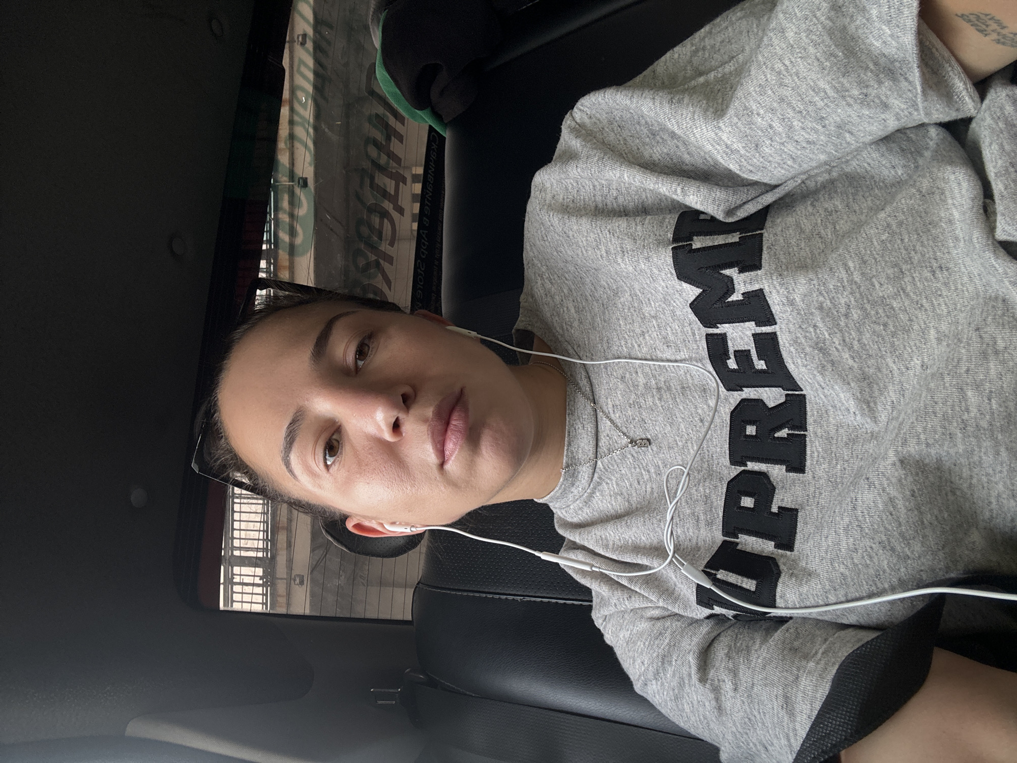 Woman in Supreme sweatshirt observed in car in Moscow