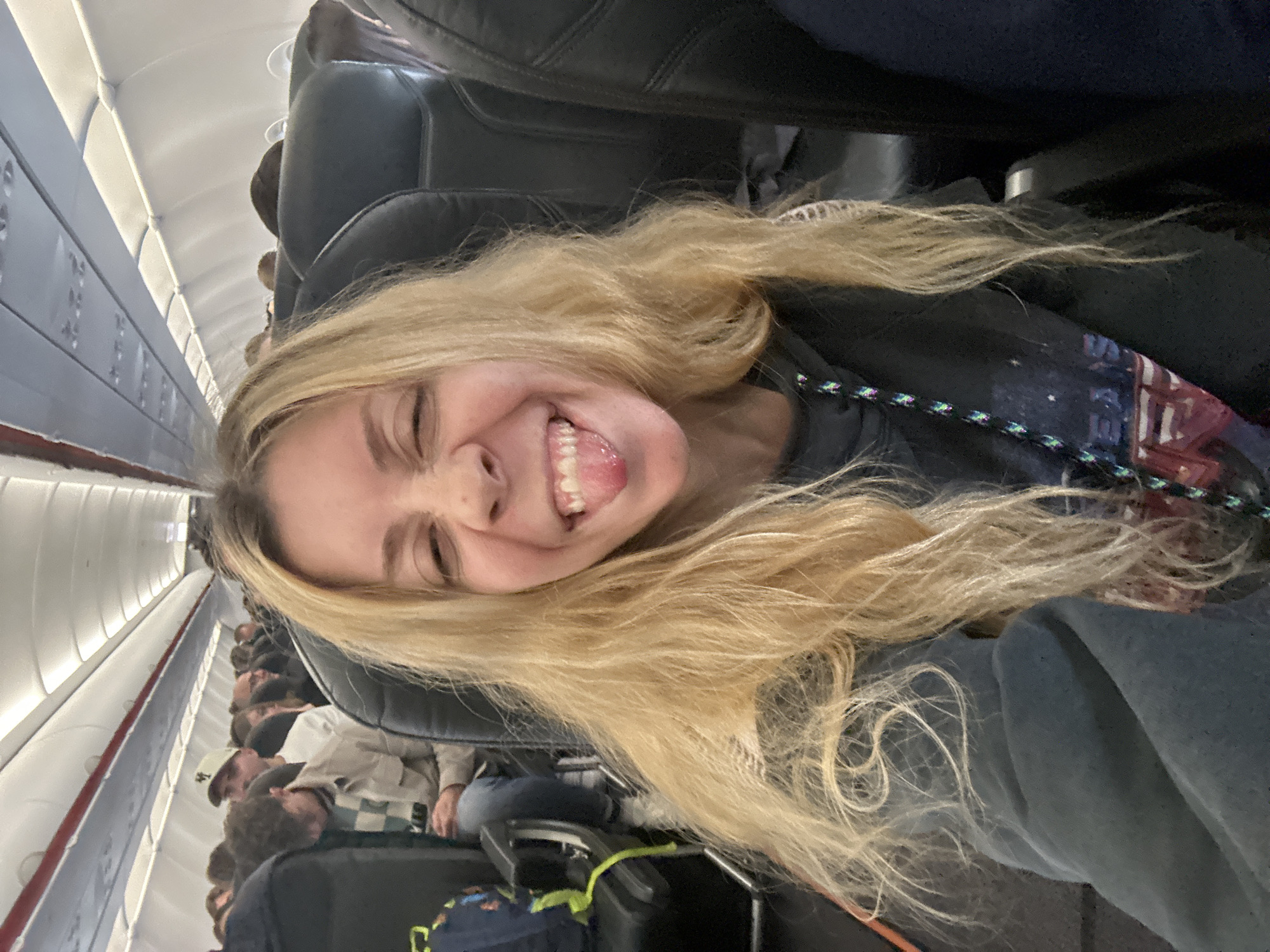 Woman makes silly face during flight near Amsterdam