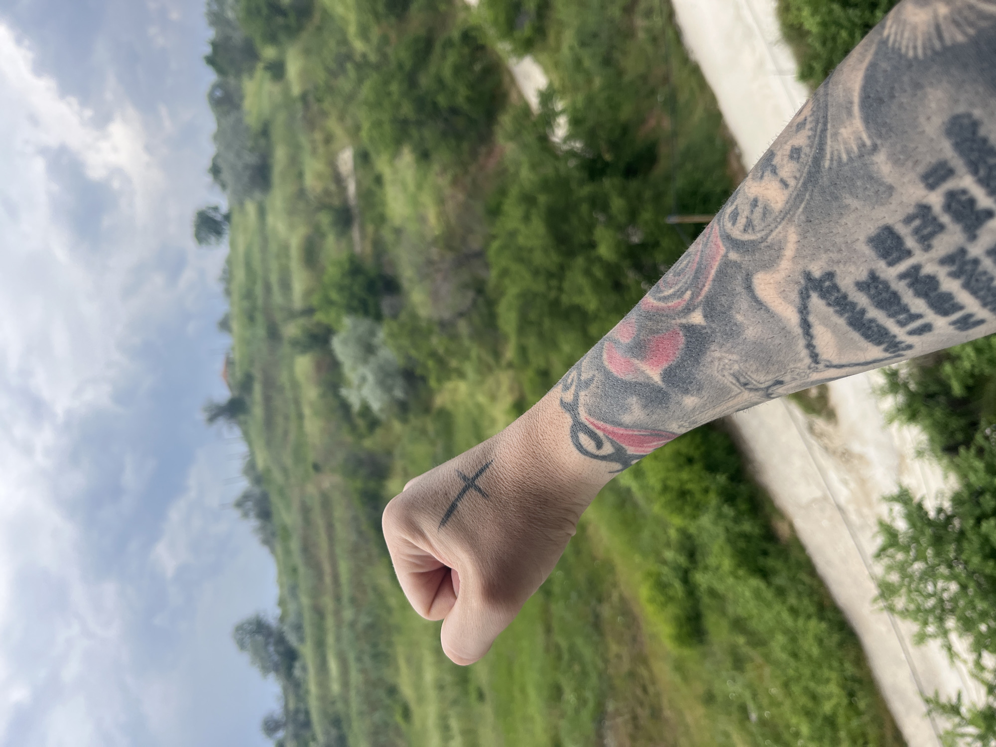 Tattooed fist with cross displayed in Varna, Bulgaria