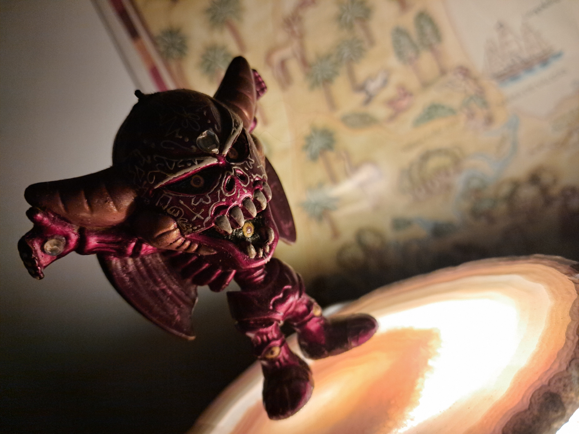 Devil figurine spotted on illuminated lamp fixture