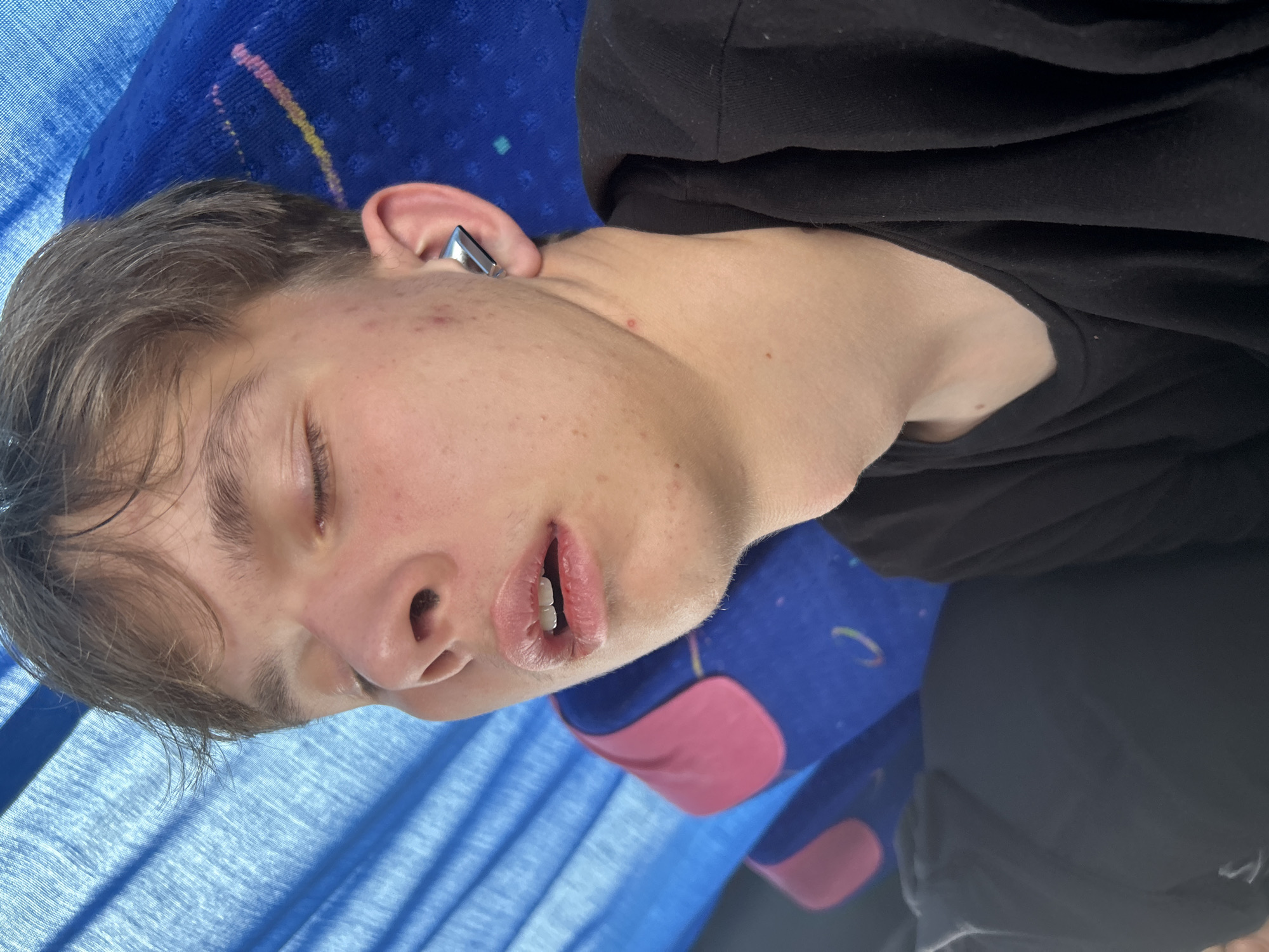 Young man sleeps on bus seat in Bulgaria