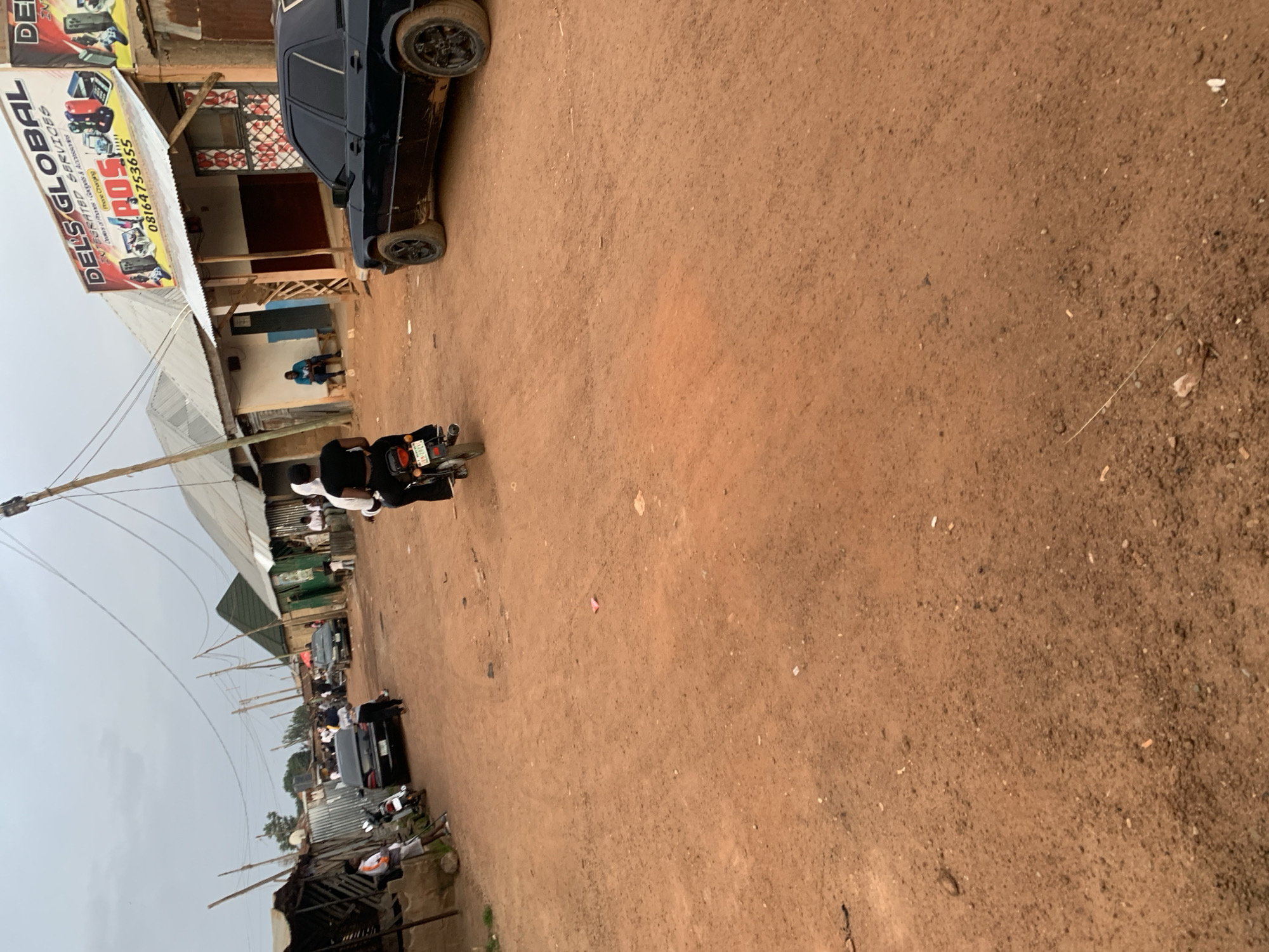 Street life along dusty roads in Bukuru and Du, Nigeria