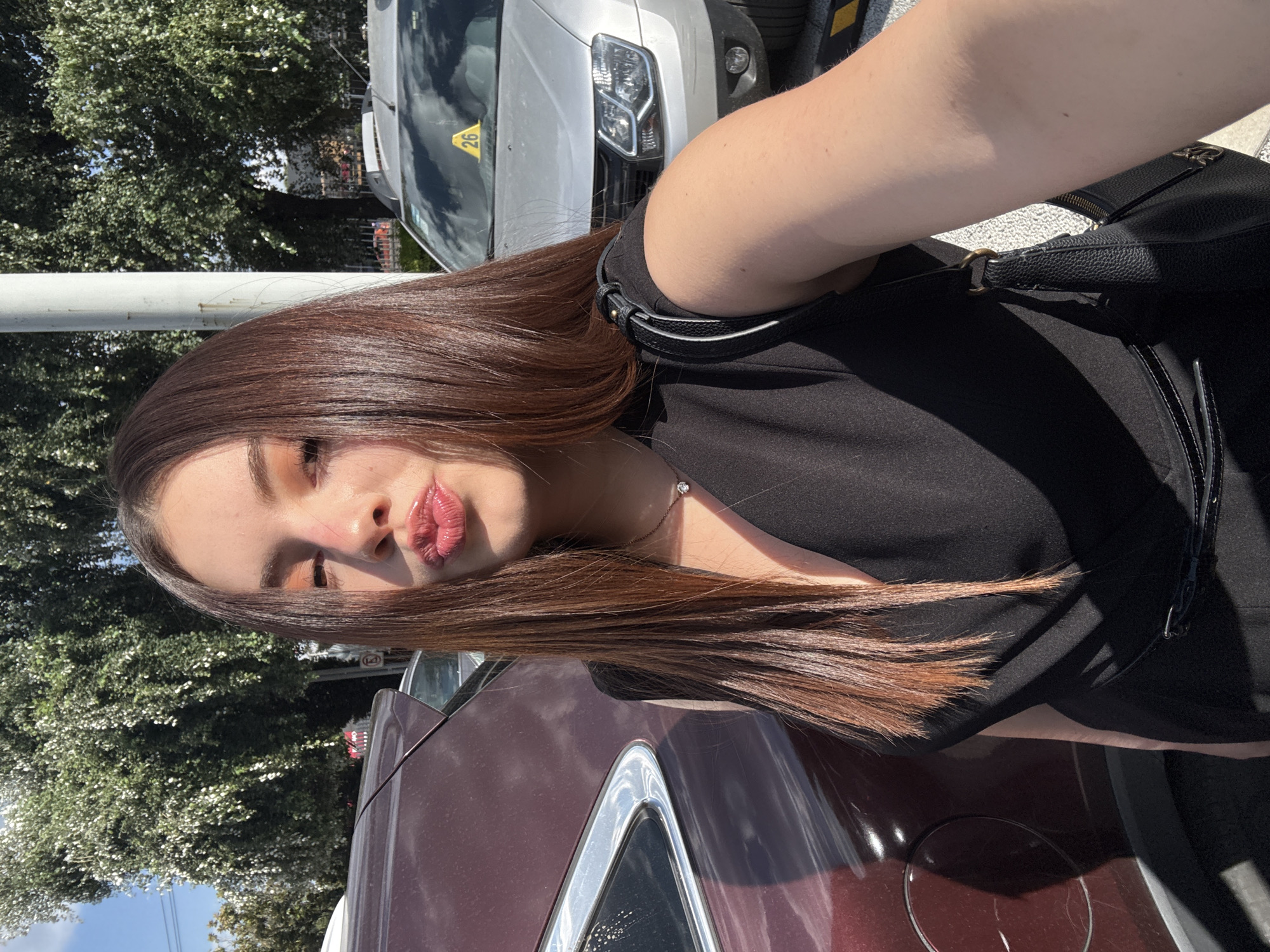 Woman takes selfies in Mexico City parking area