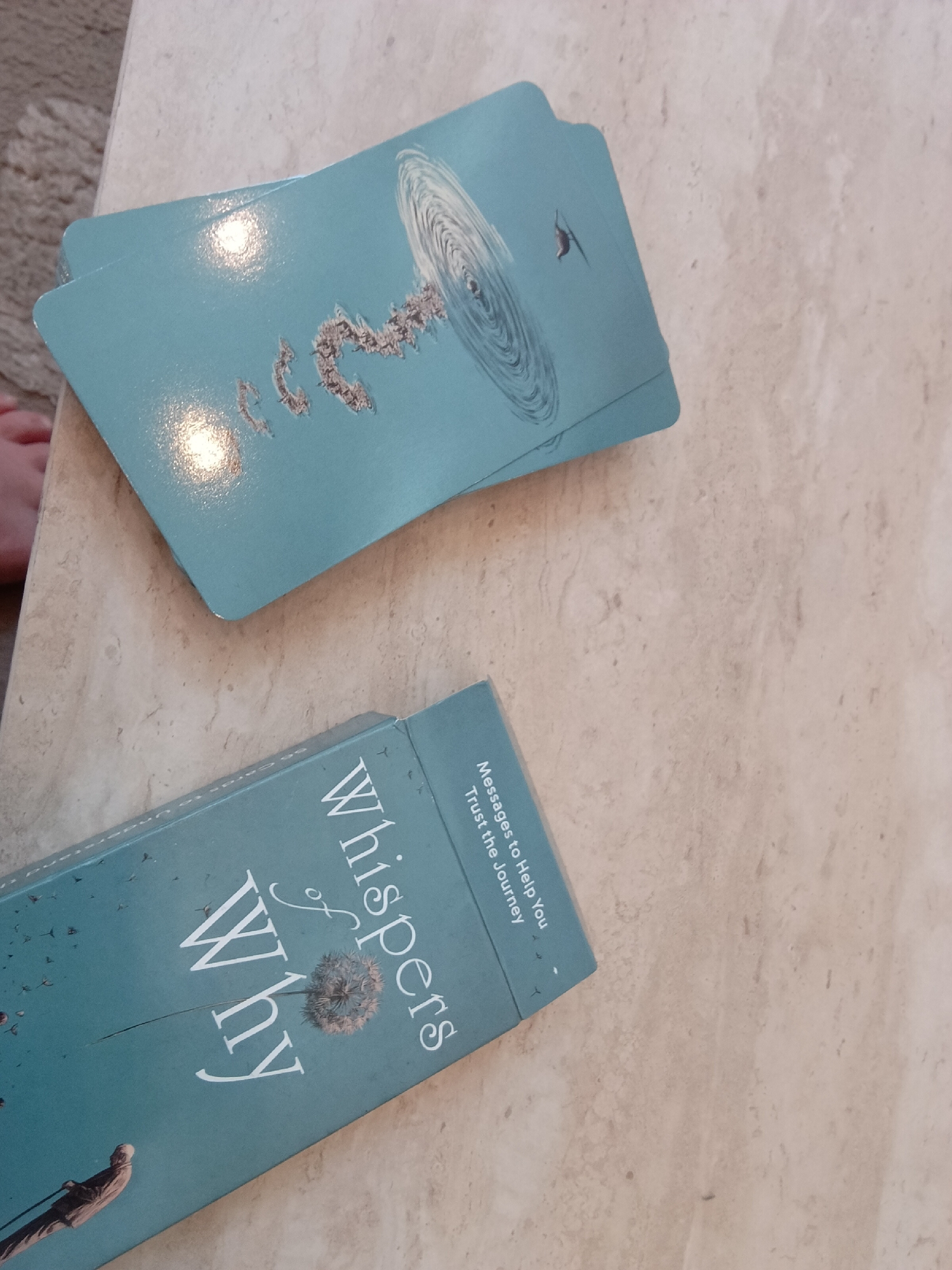 Spiritual cards and books documented in quiet home setting