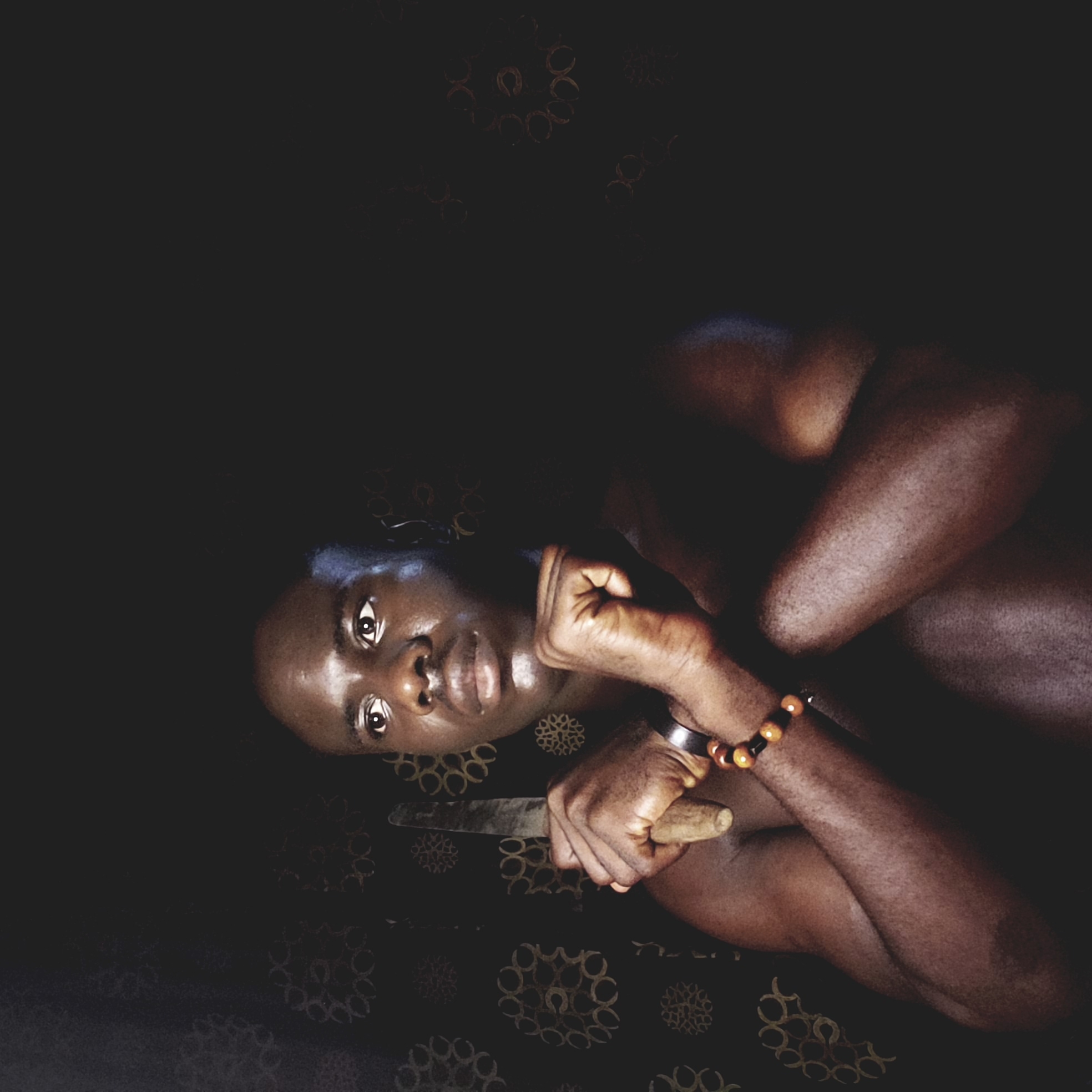 Person resting on patterned surface in Narayi, Nigeria
