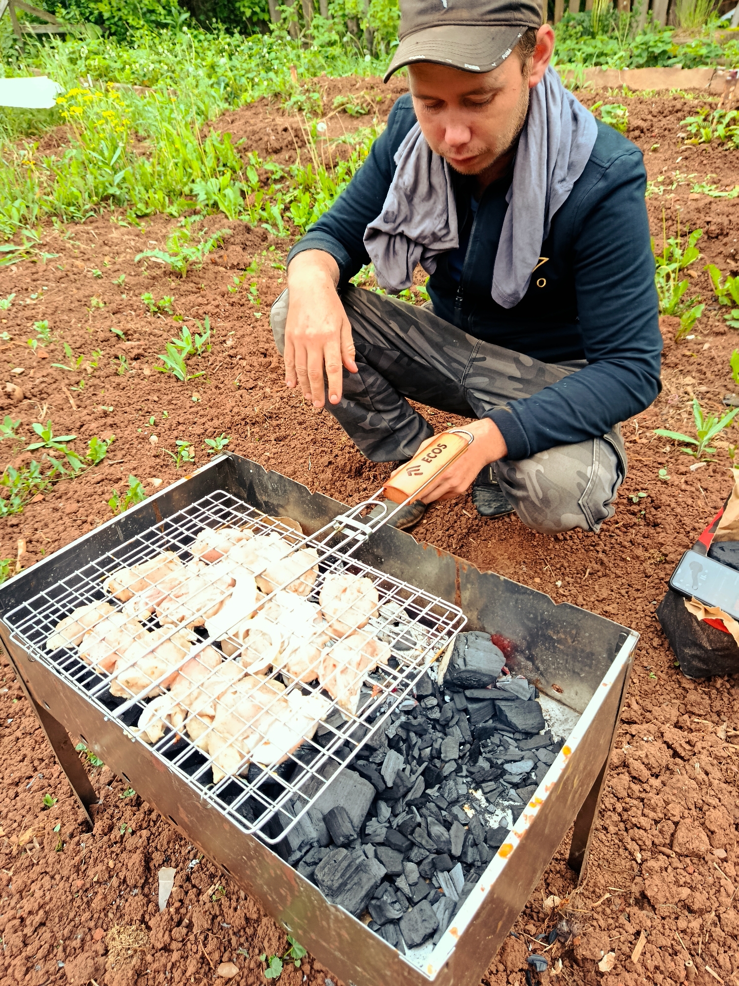 Family barbecue gathering with children playing in Фоки, Russia