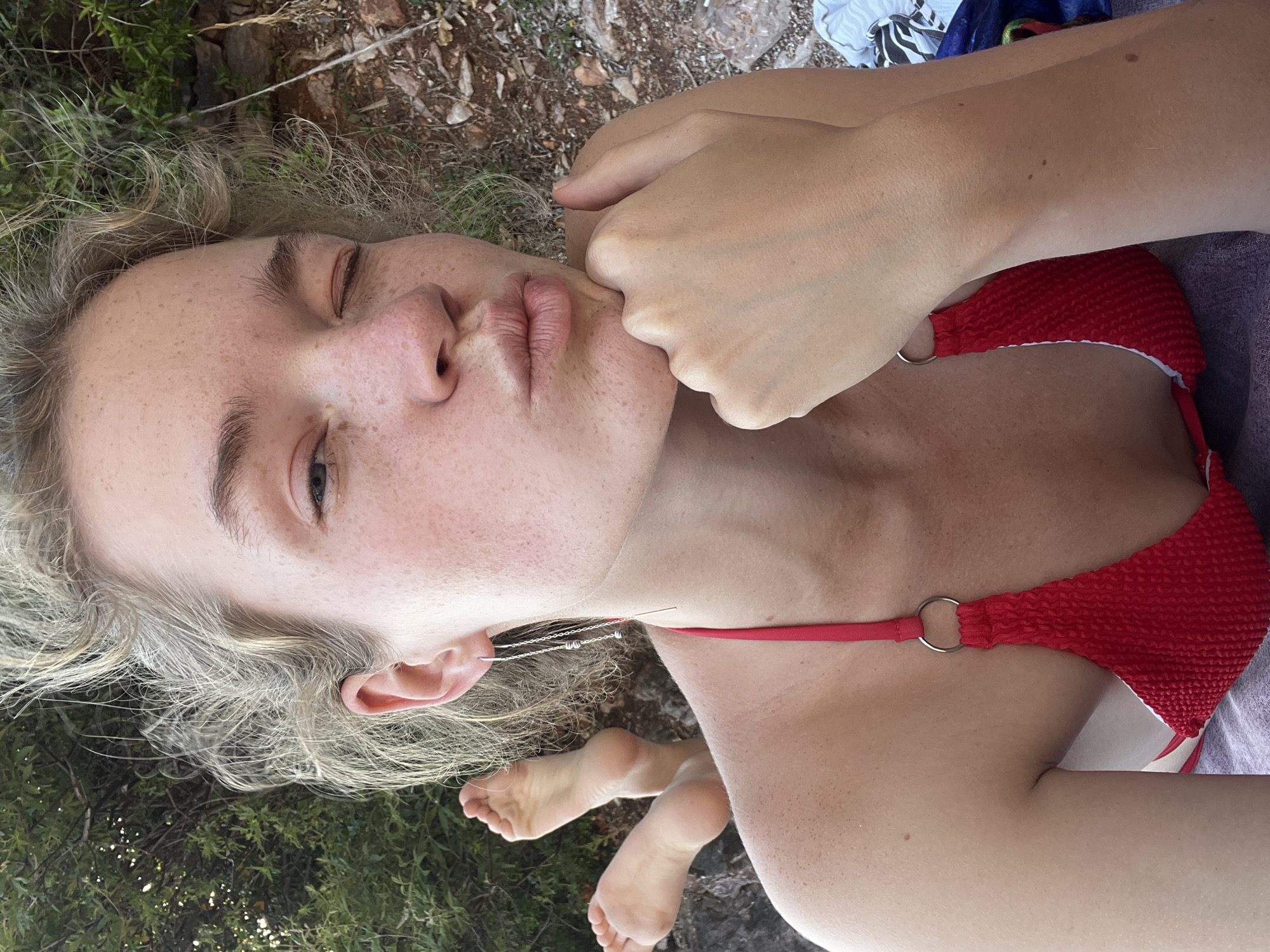 Woman photographed at sunny Rađenovići beach near Sveti Stefan