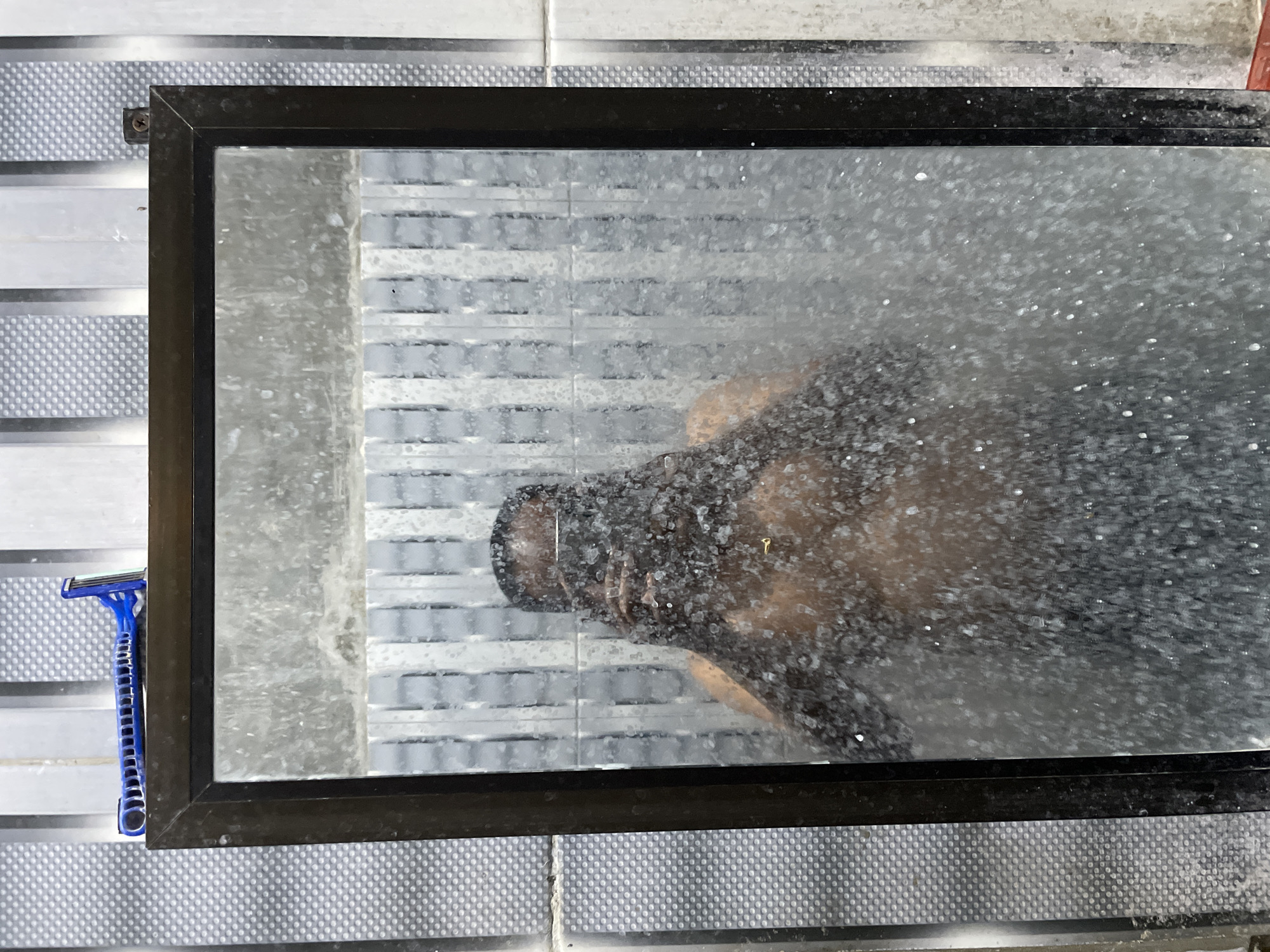 Mirror selfie in a steamy bathroom in Lhokseumawe
