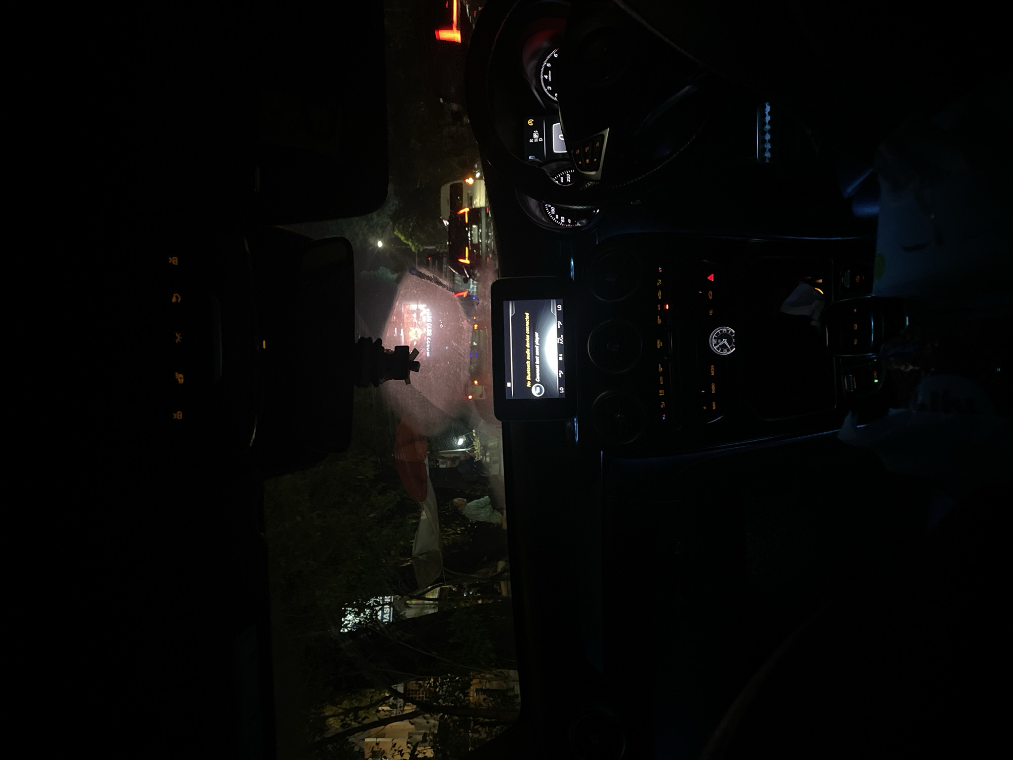 Nighttime drive through Bogor captured from inside vehicle