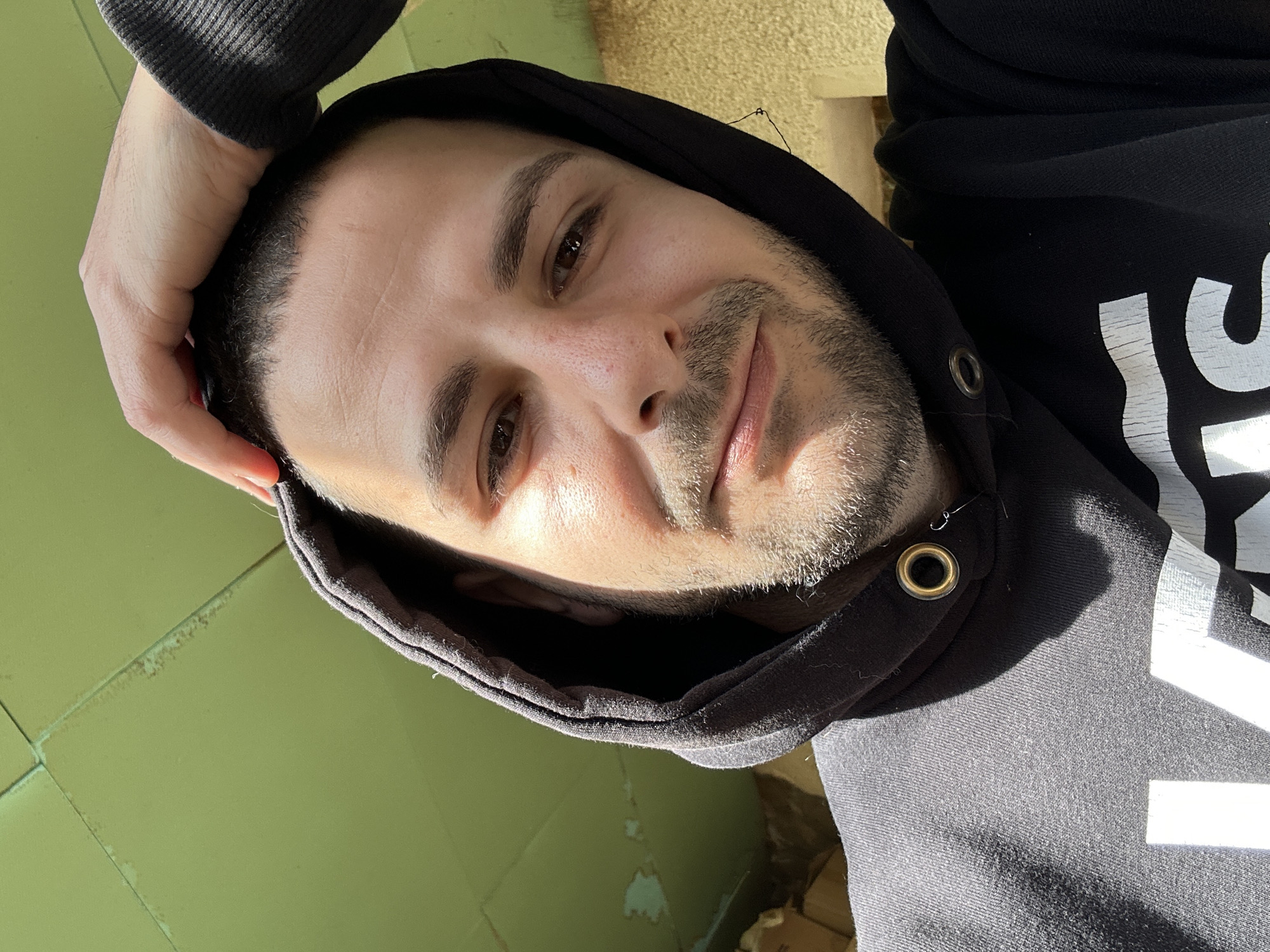 Man takes selfie in black hoodie in Slavyani, Bulgaria