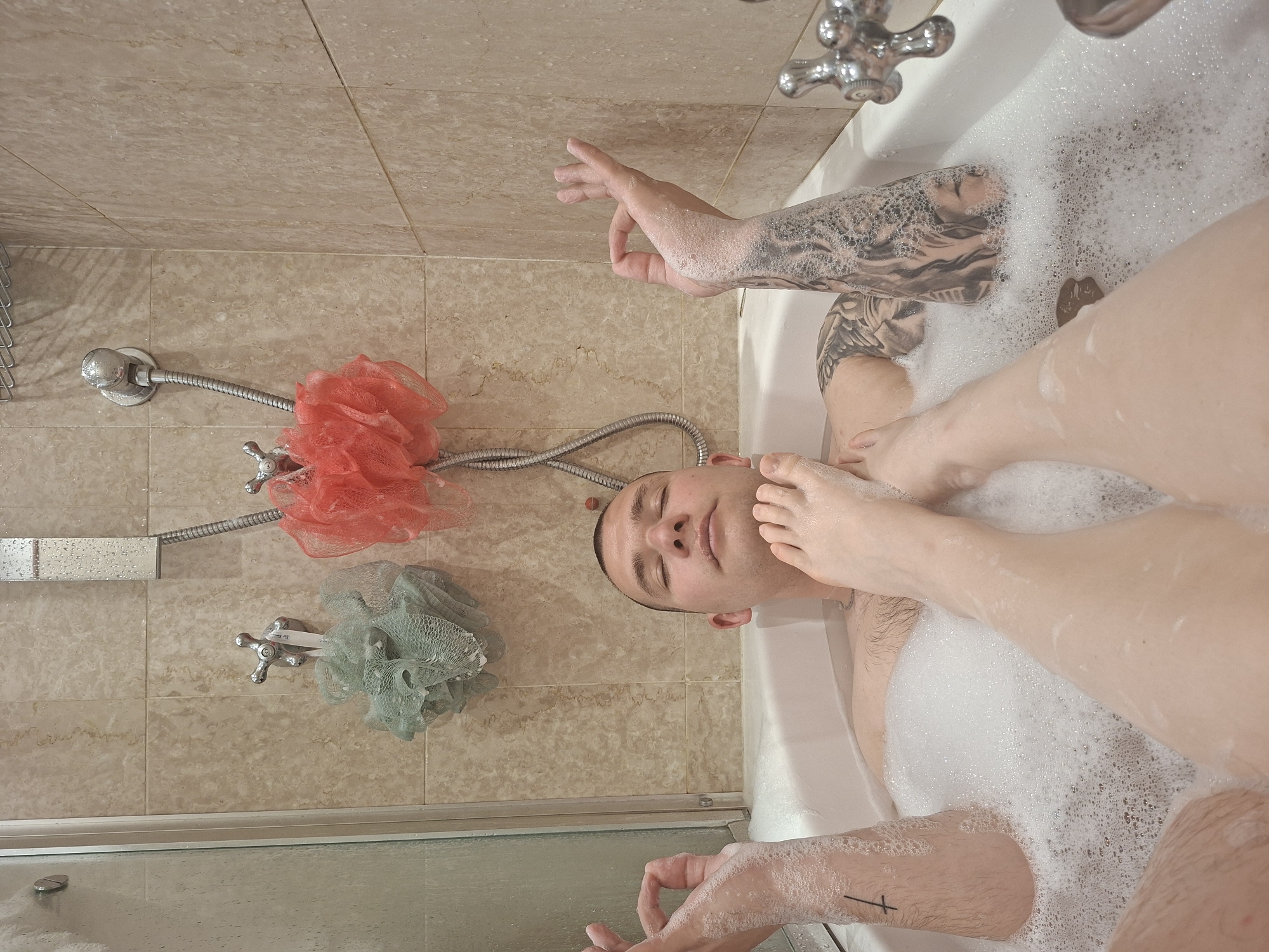 Unusual bathroom scene involving two tattooed individuals in Milan