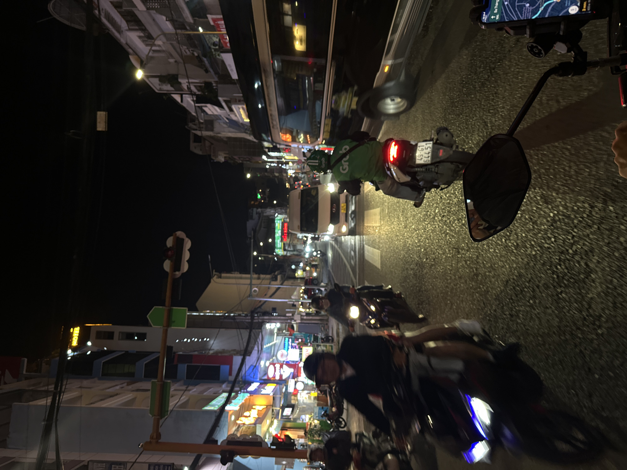 Nighttime streets and storefronts across central Đà Lạt