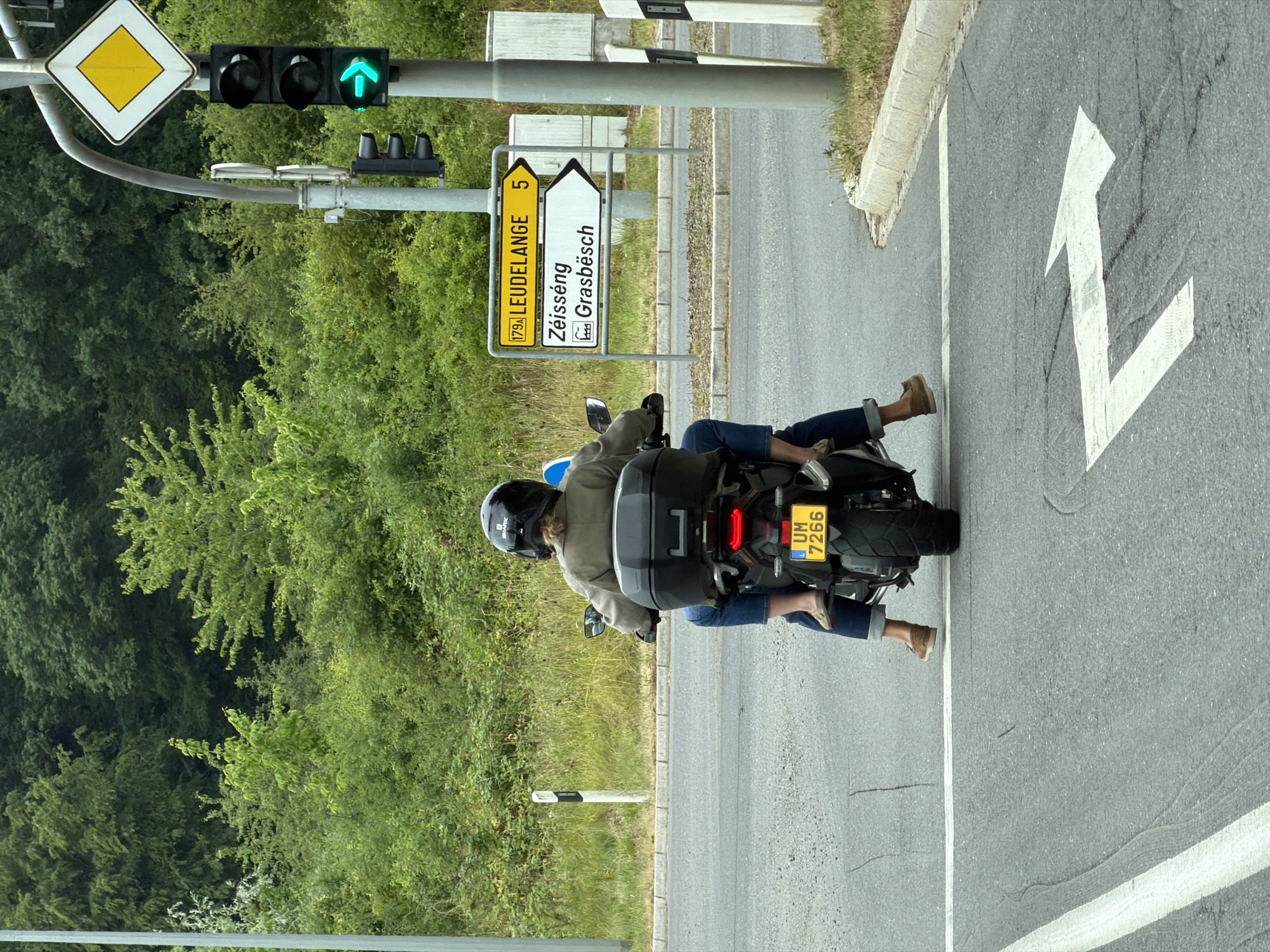 Motorcyclist paused at a green right-turn light in Luxembourg