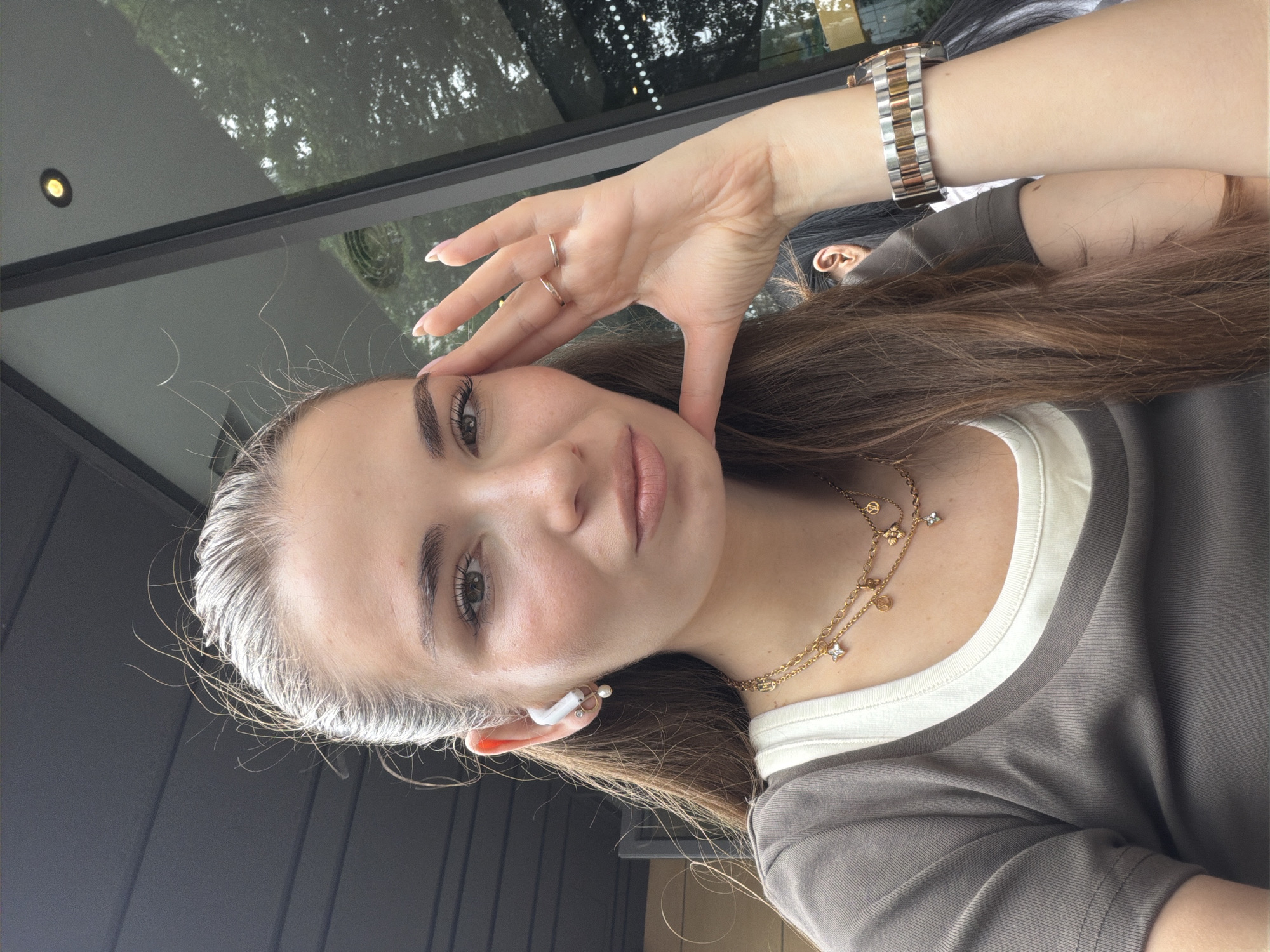Woman takes morning selfies in Panyu District cafe scene